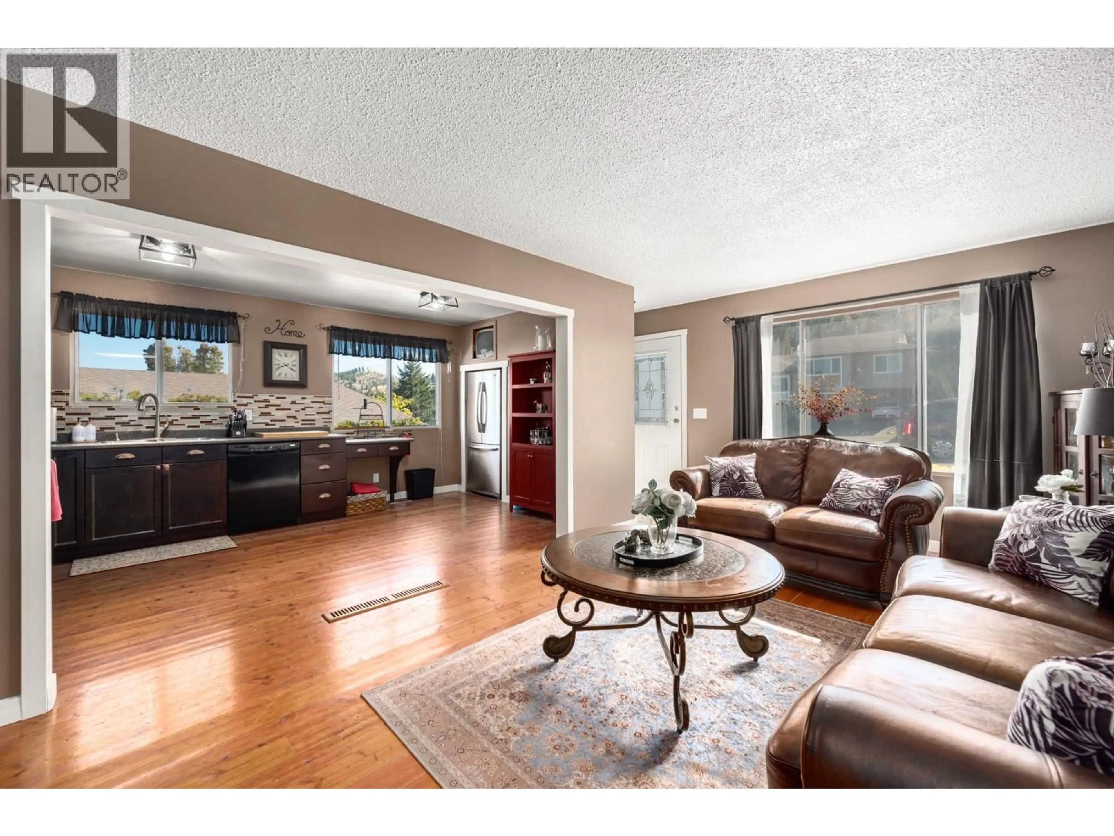 Living room with furniture, wood/laminate floor for 392 WADDINGTON DRIVE, Kamloops British Columbia V2E1M5