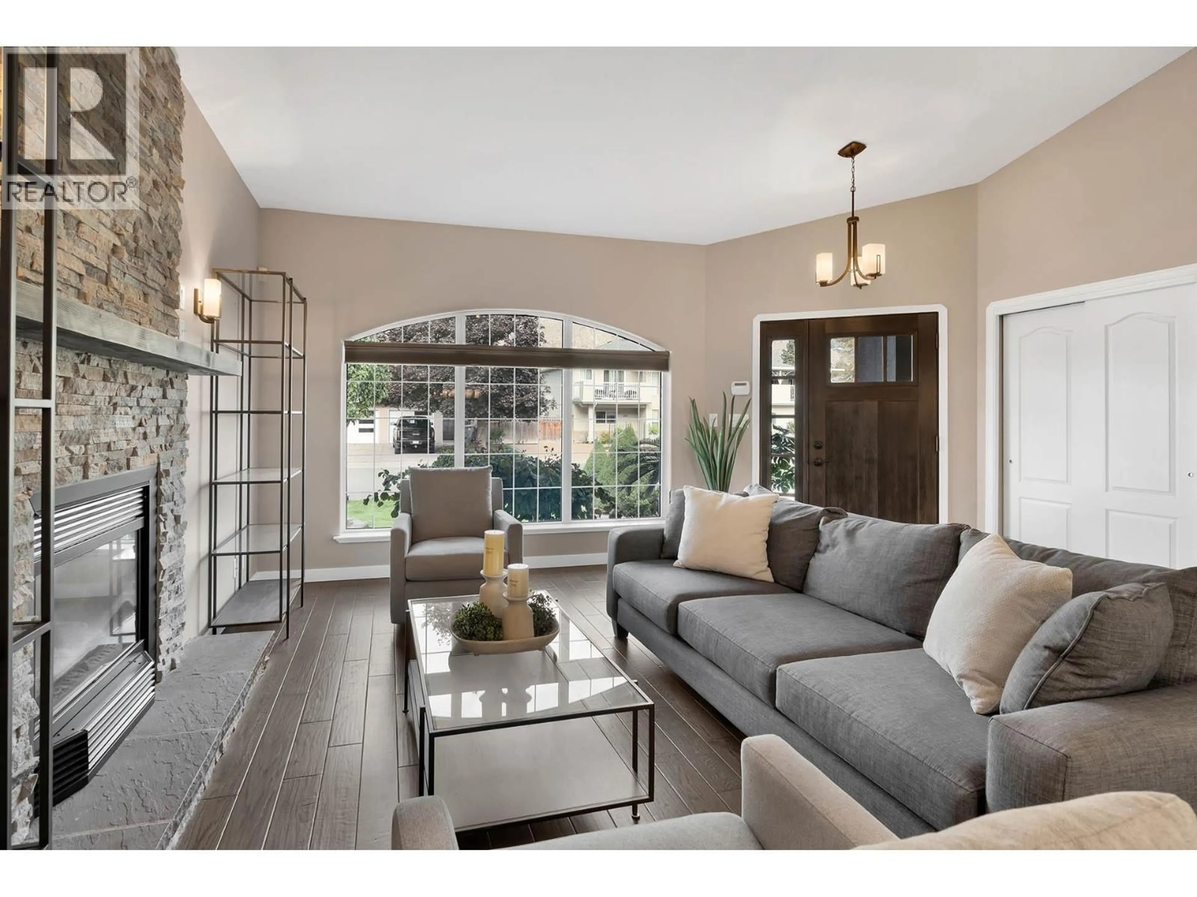 Living room with furniture, wood/laminate floor for 3723 OVERLANDER DRIVE, Kamloops British Columbia V2B8M4