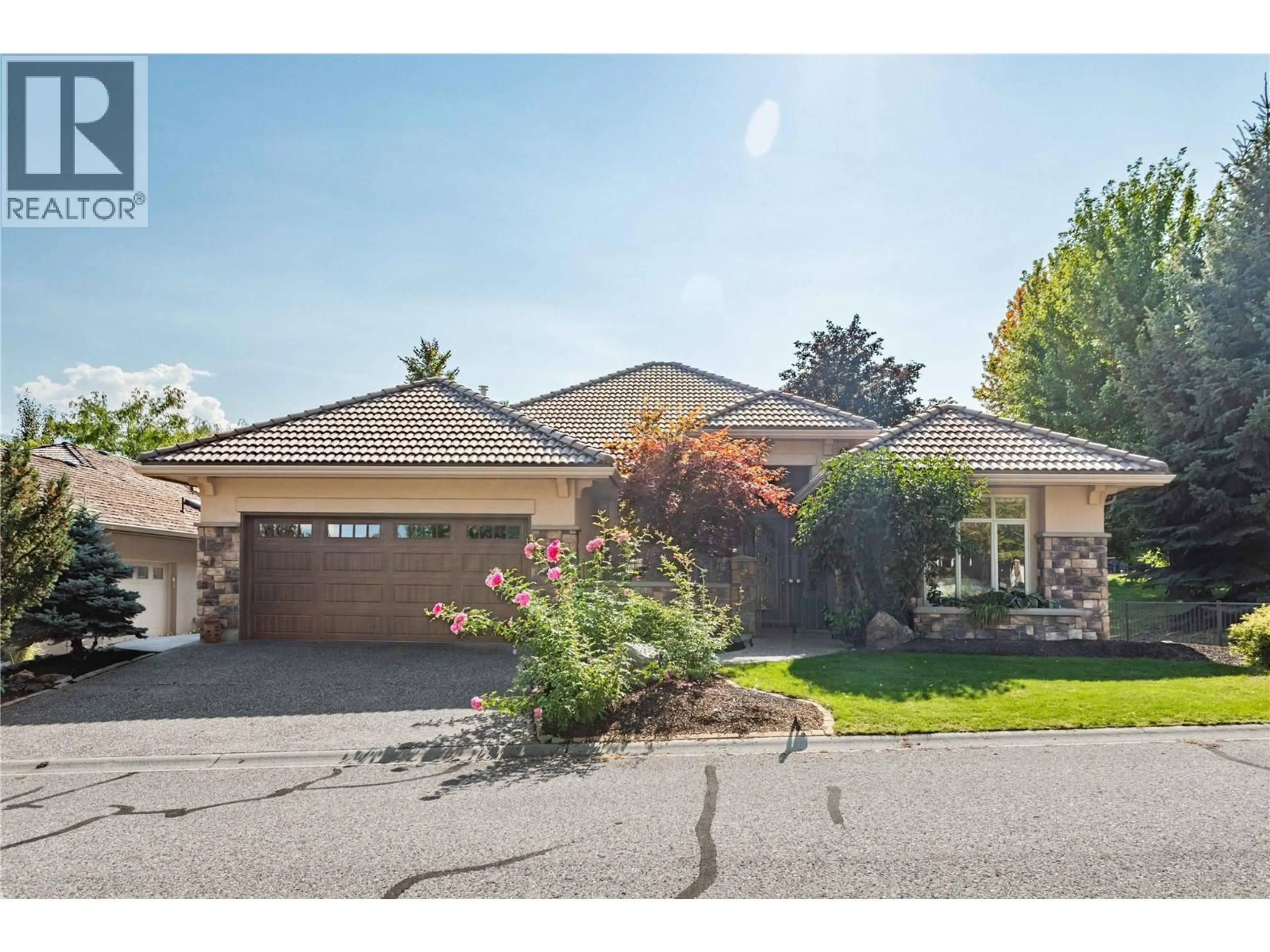 Home with brick exterior material, street for 4157 GALLAGHERS PARKLAND DRIVE, Kelowna British Columbia V1W3Z8