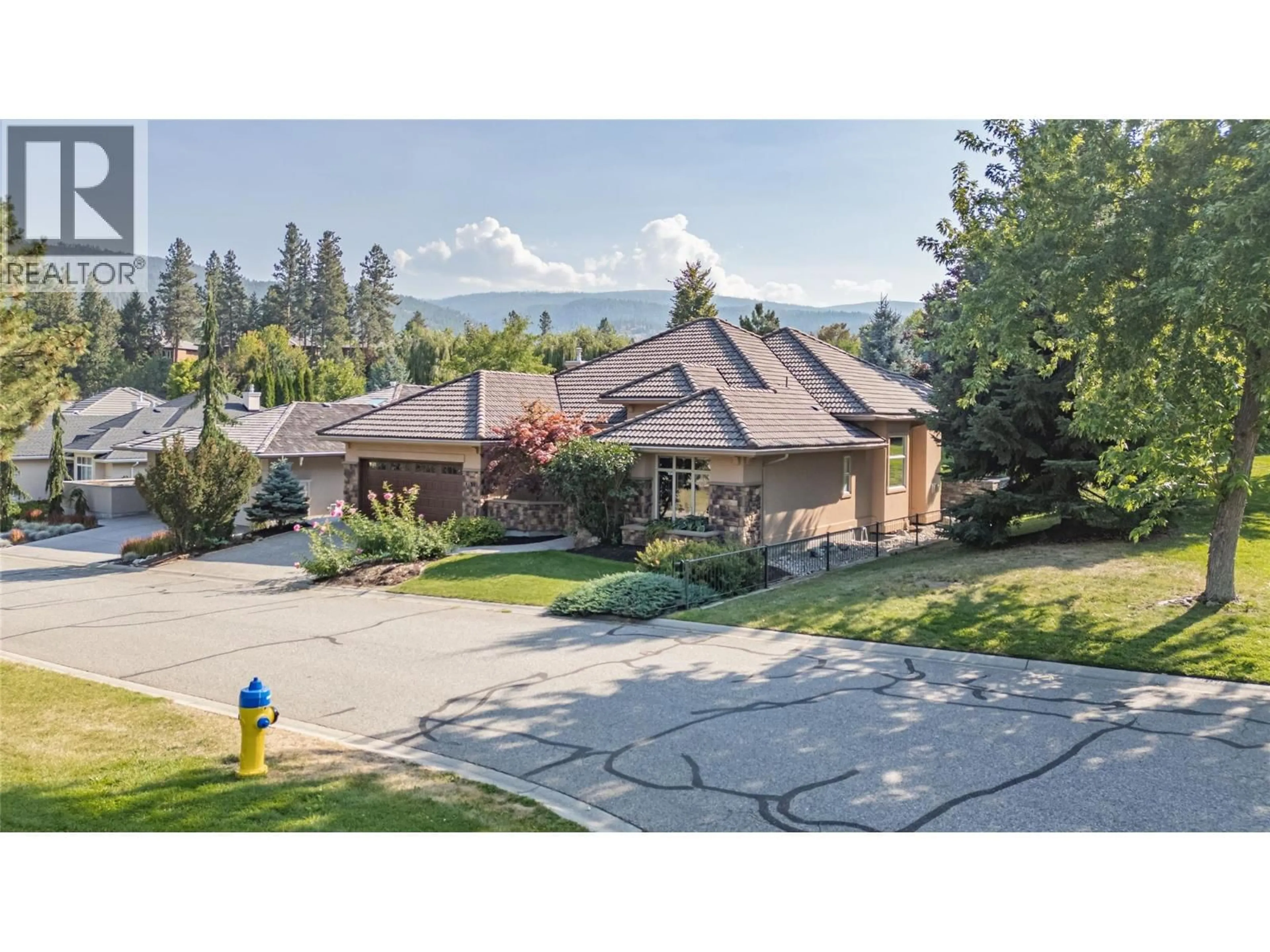 A pic from outside/outdoor area/front of a property/back of a property/a pic from drone, mountain view for 4157 GALLAGHERS PARKLAND DRIVE, Kelowna British Columbia V1W3Z8