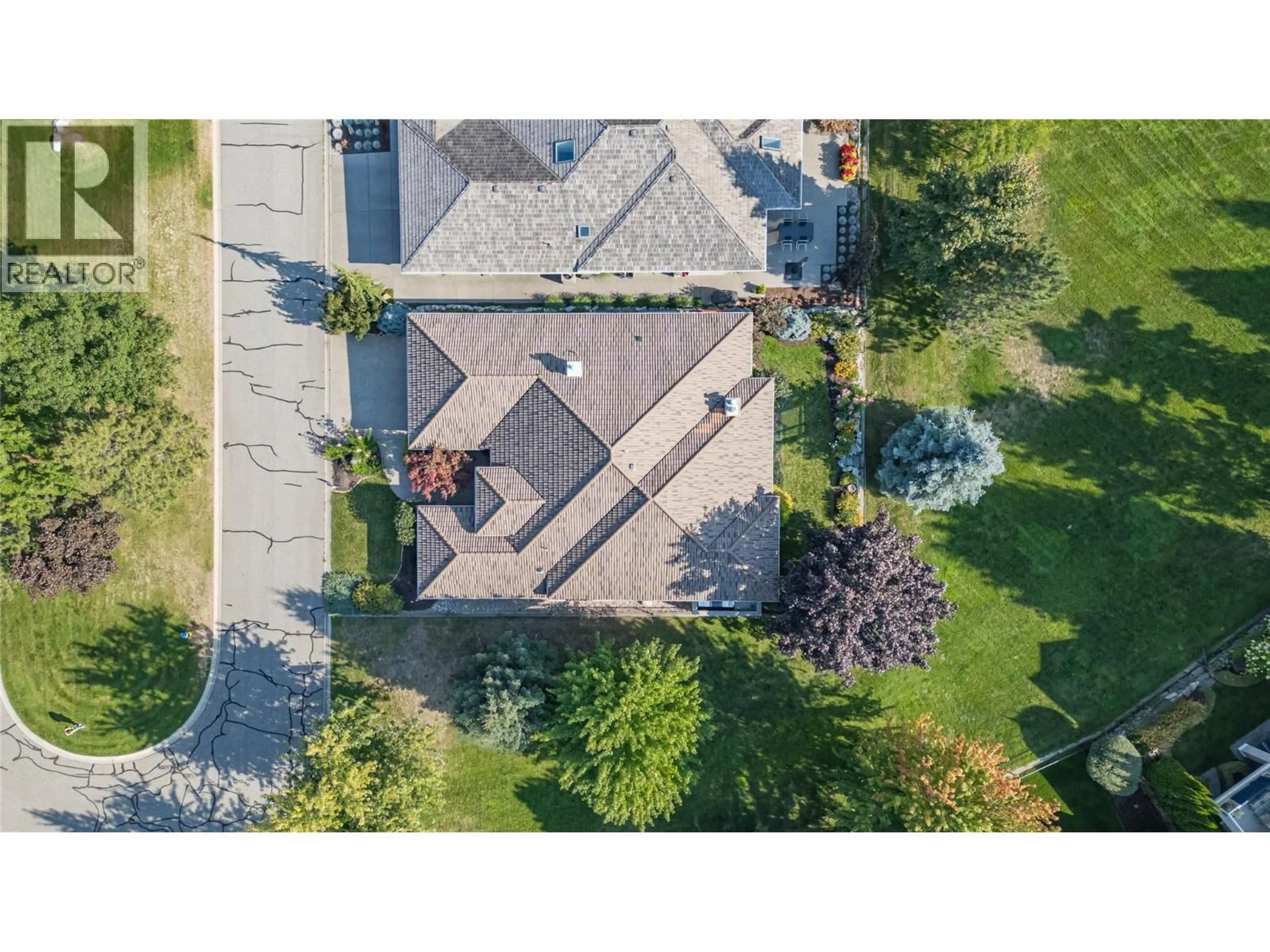 A pic from outside/outdoor area/front of a property/back of a property/a pic from drone, street for 4157 GALLAGHERS PARKLAND DRIVE, Kelowna British Columbia V1W3Z8