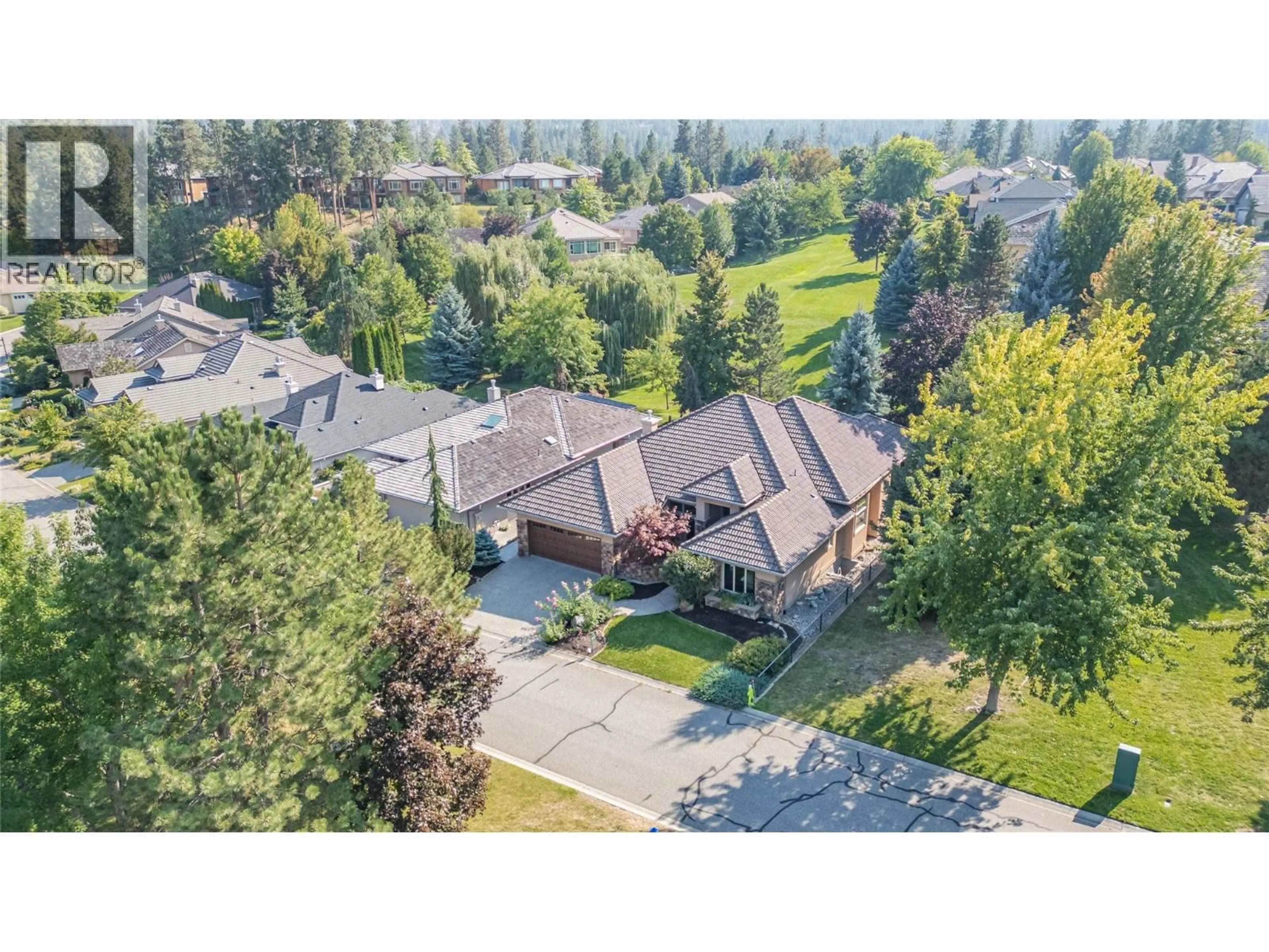 A pic from outside/outdoor area/front of a property/back of a property/a pic from drone, mountain view for 4157 GALLAGHERS PARKLAND DRIVE, Kelowna British Columbia V1W3Z8