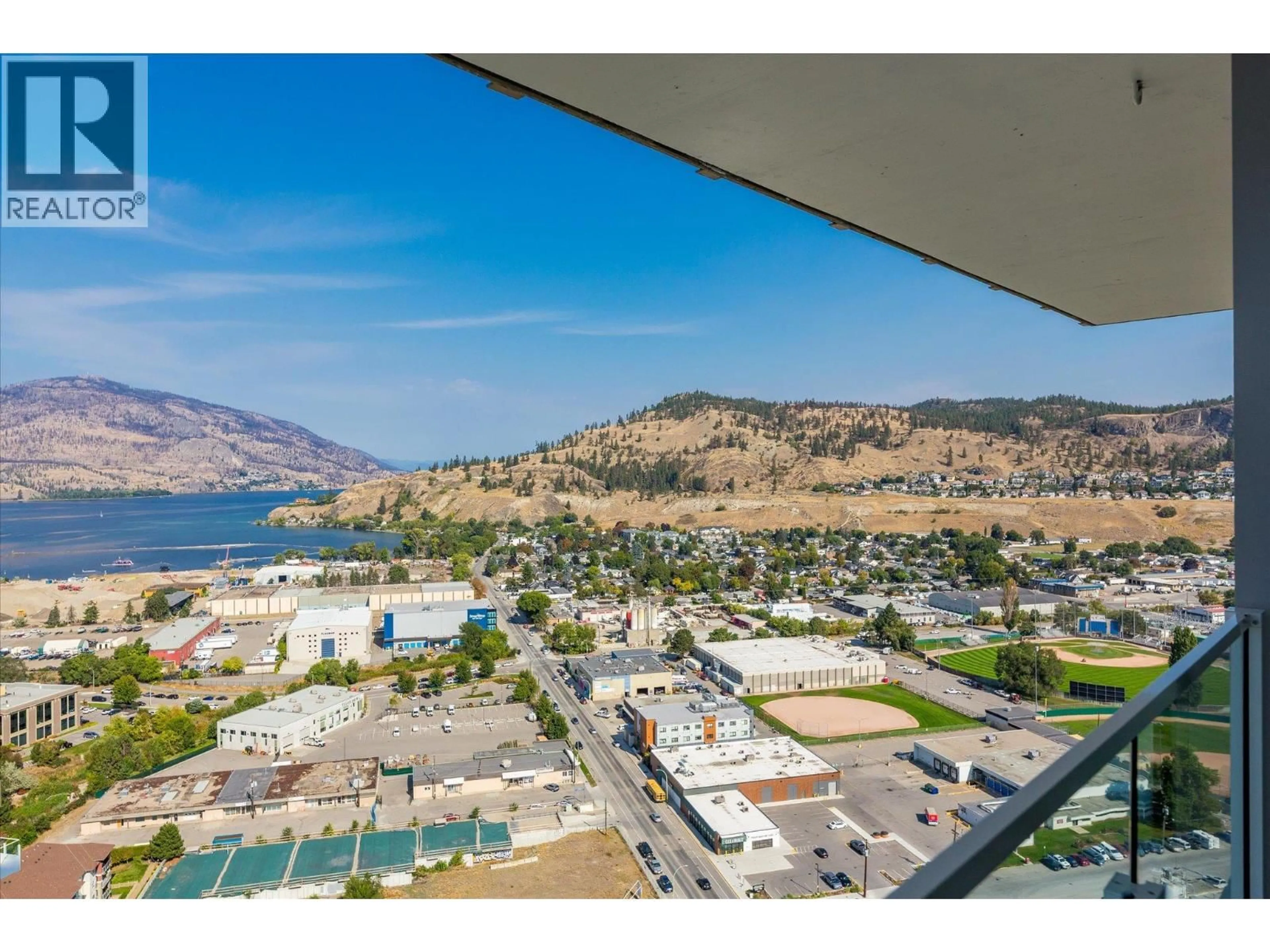 A pic from outside/outdoor area/front of a property/back of a property/a pic from drone, water/lake/river/ocean view for 2906 - 1191 SUNSET DRIVE, Kelowna British Columbia V1Y0J4