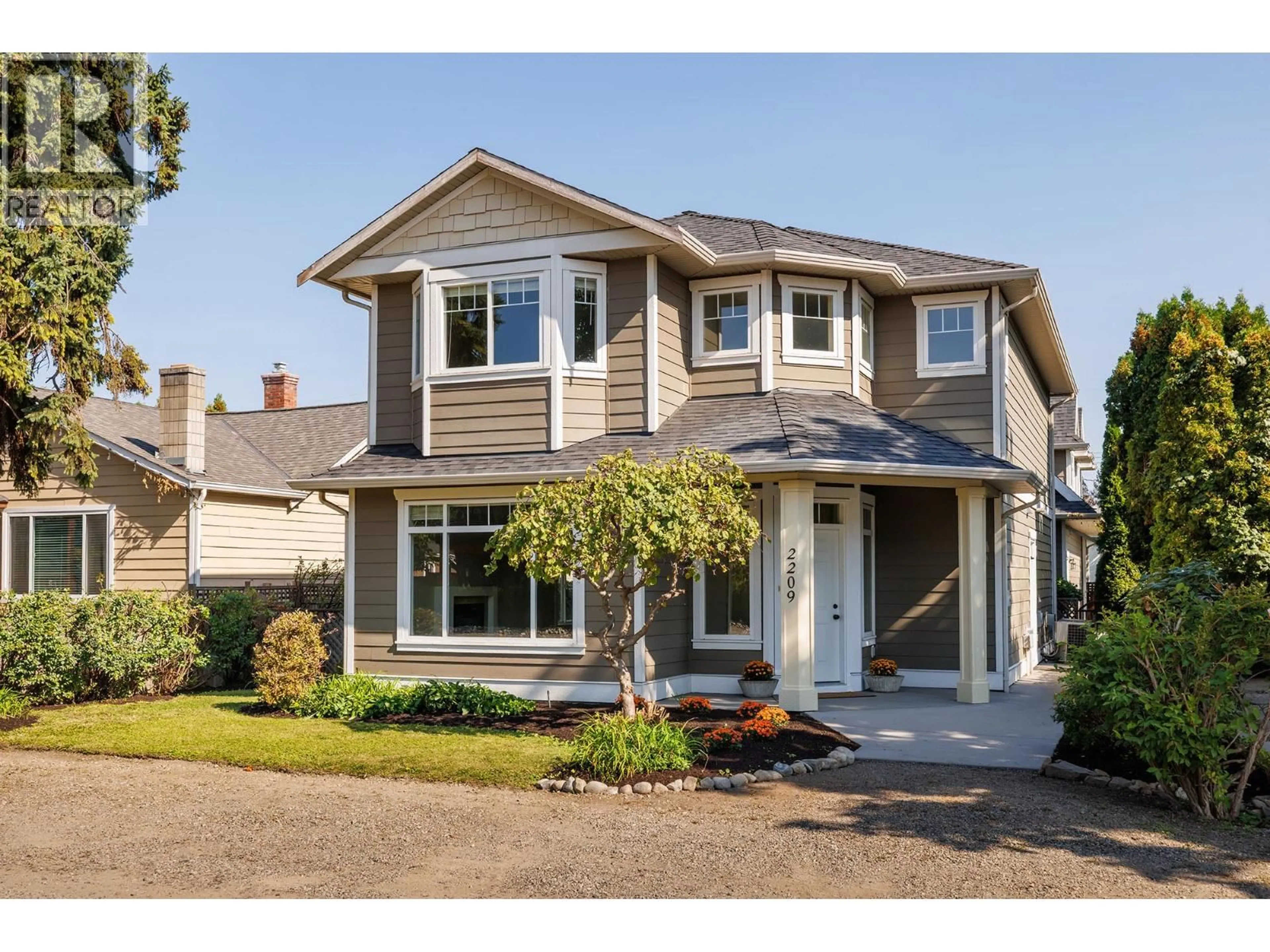 Home with vinyl exterior material, street for 2209 WOODLAWN STREET, Kelowna British Columbia V1Y2T1