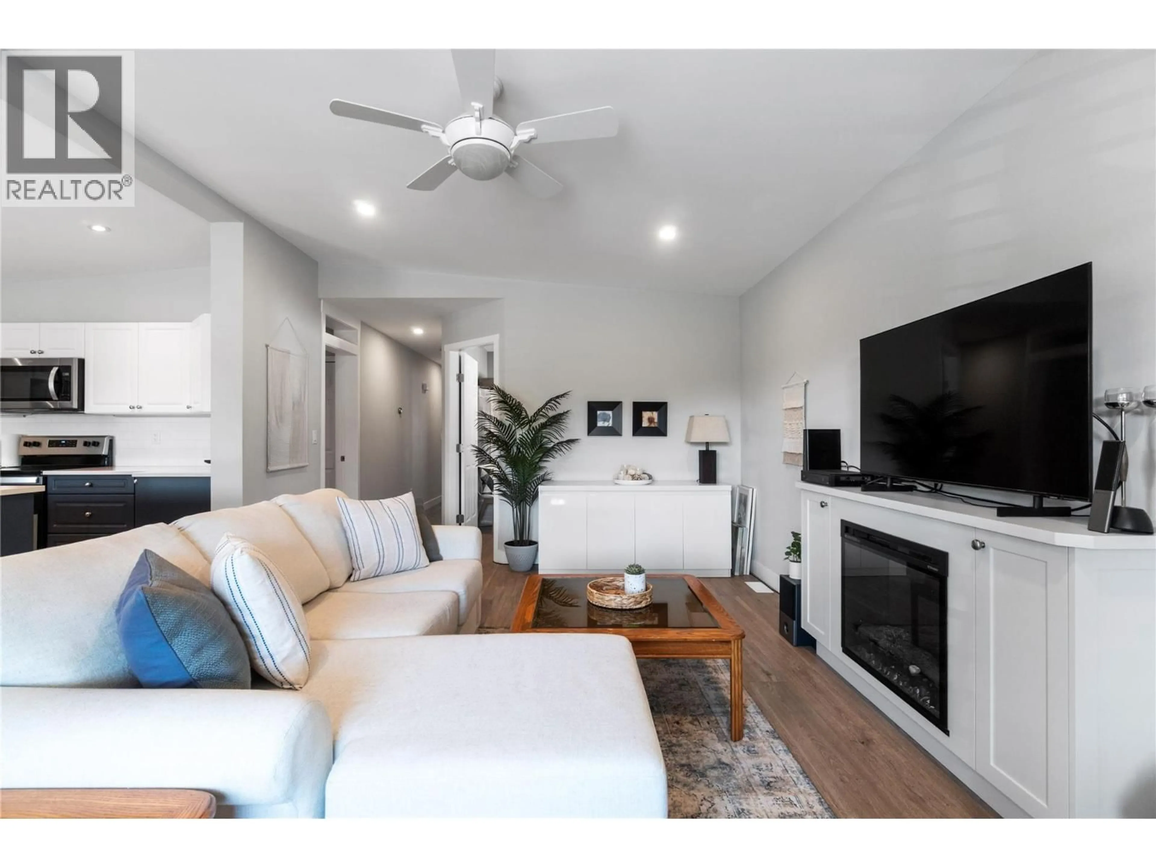 Living room with furniture, wood/laminate floor for 728 ELDERBERRY WALK, Sicamous British Columbia V0E2V0