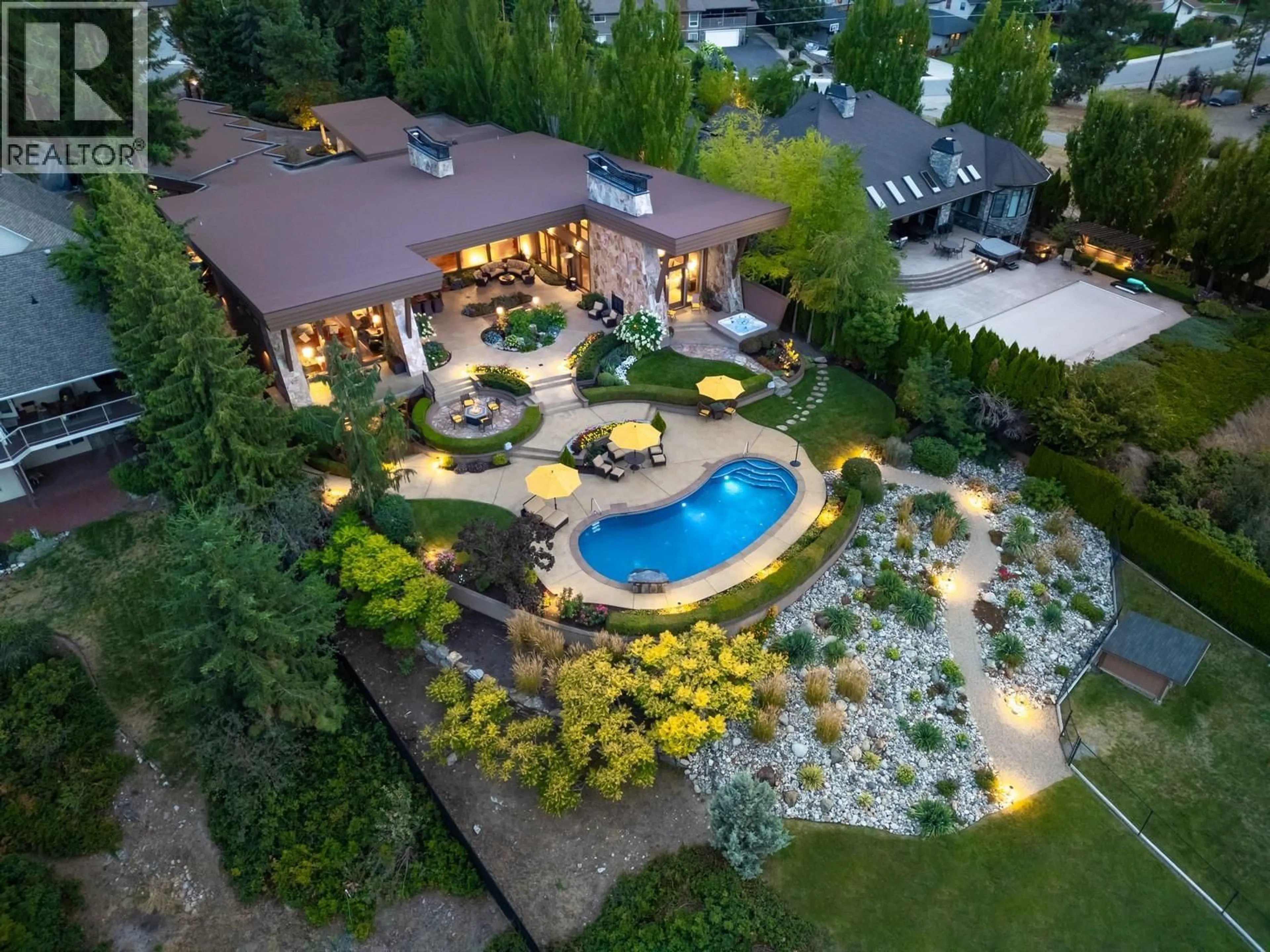 A pic from outside/outdoor area/front of a property/back of a property/a pic from drone, unknown for 704 BARNABY ROAD, Kelowna British Columbia V1W4N9
