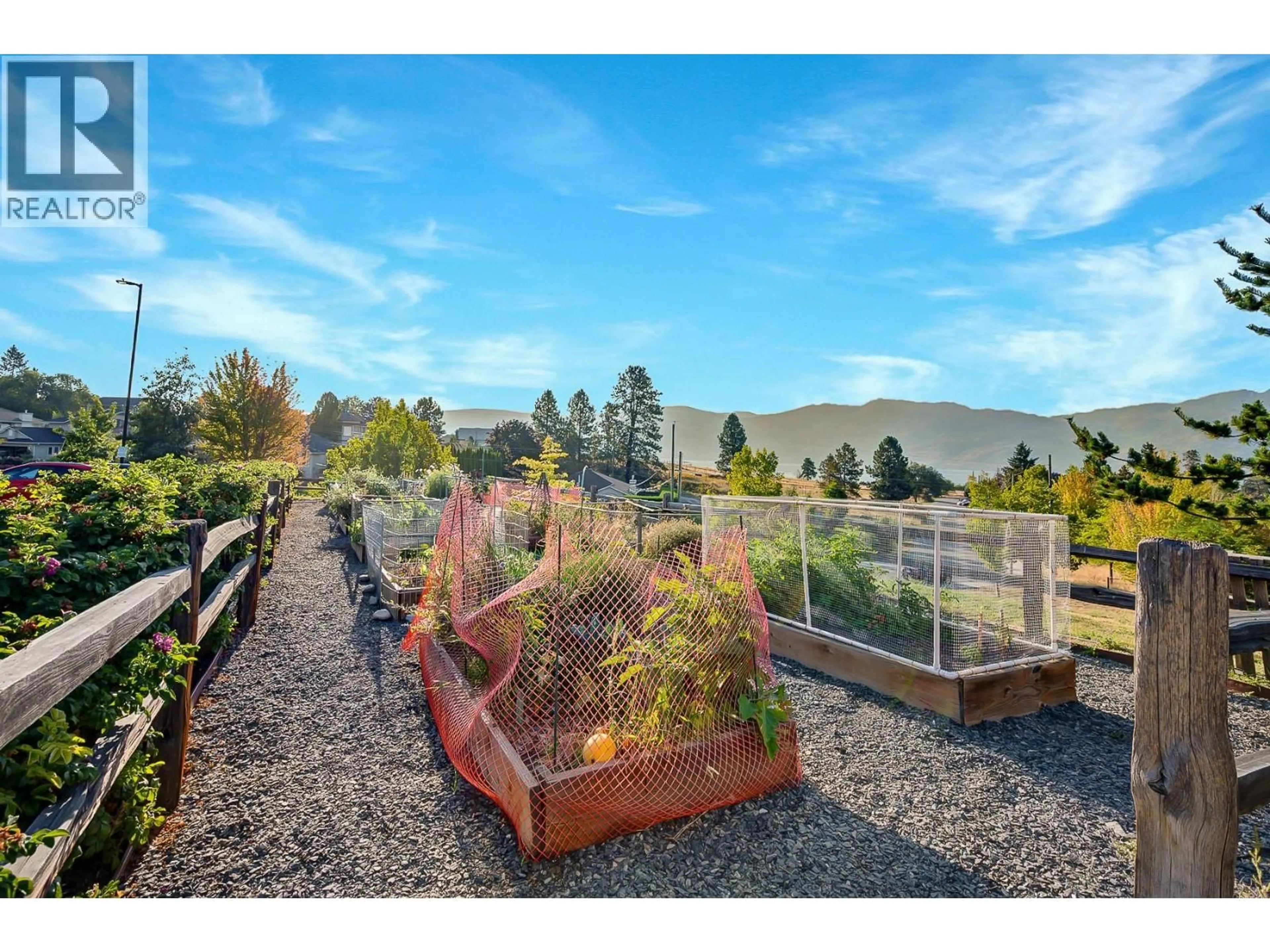 A pic from outside/outdoor area/front of a property/back of a property/a pic from drone, mountain view for 103 - 2250 MAJOROS ROAD, West Kelowna British Columbia V4T0A6