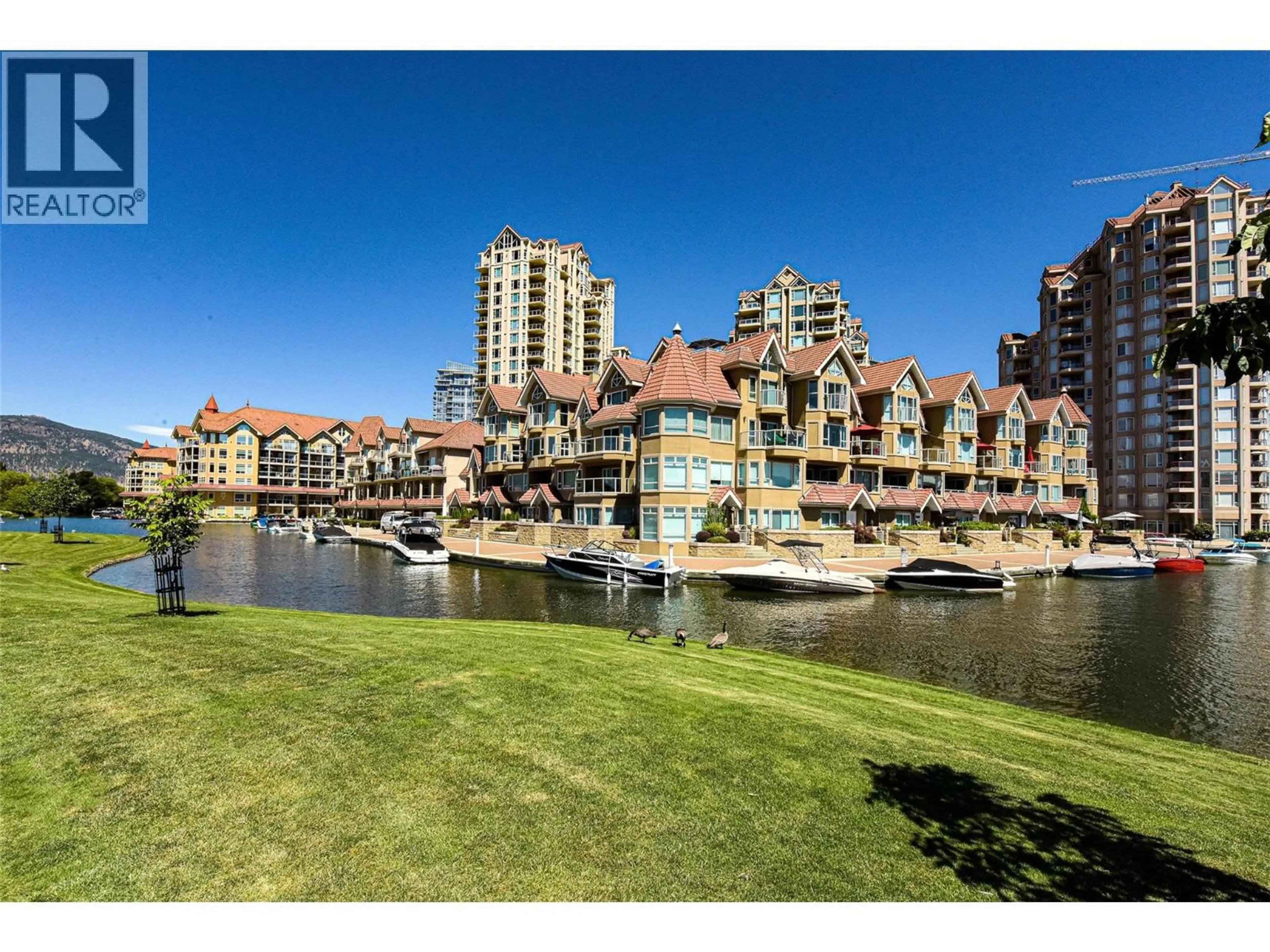 A pic from outside/outdoor area/front of a property/back of a property/a pic from drone, water/lake/river/ocean view for 606 - 1152 SUNSET DRIVE, Kelowna British Columbia V1Y9R7