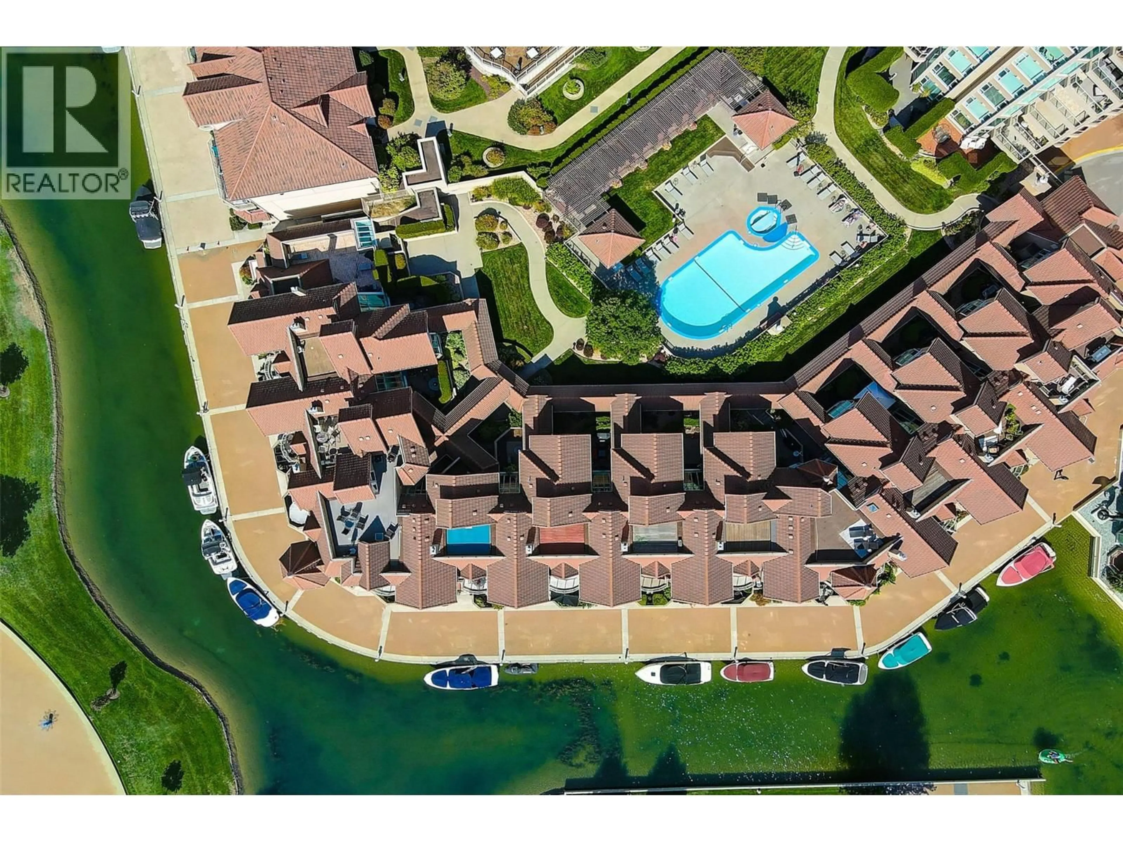 A pic from outside/outdoor area/front of a property/back of a property/a pic from drone, water/lake/river/ocean view for 606 - 1152 SUNSET DRIVE, Kelowna British Columbia V1Y9R7