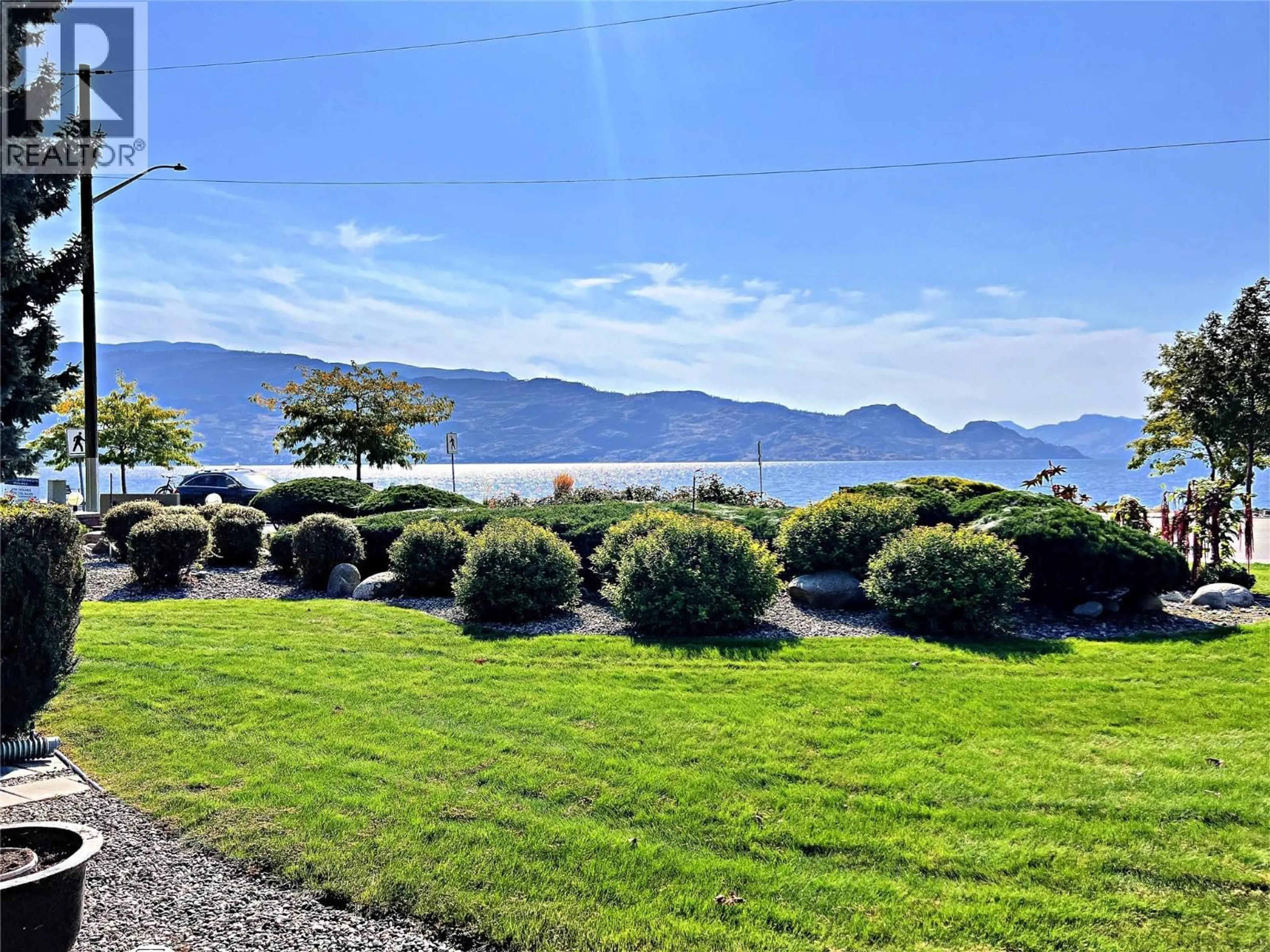 A pic from outside/outdoor area/front of a property/back of a property/a pic from drone, water/lake/river/ocean view for 102 - 4340A BEACH AVENUE, Peachland British Columbia V0H1X6