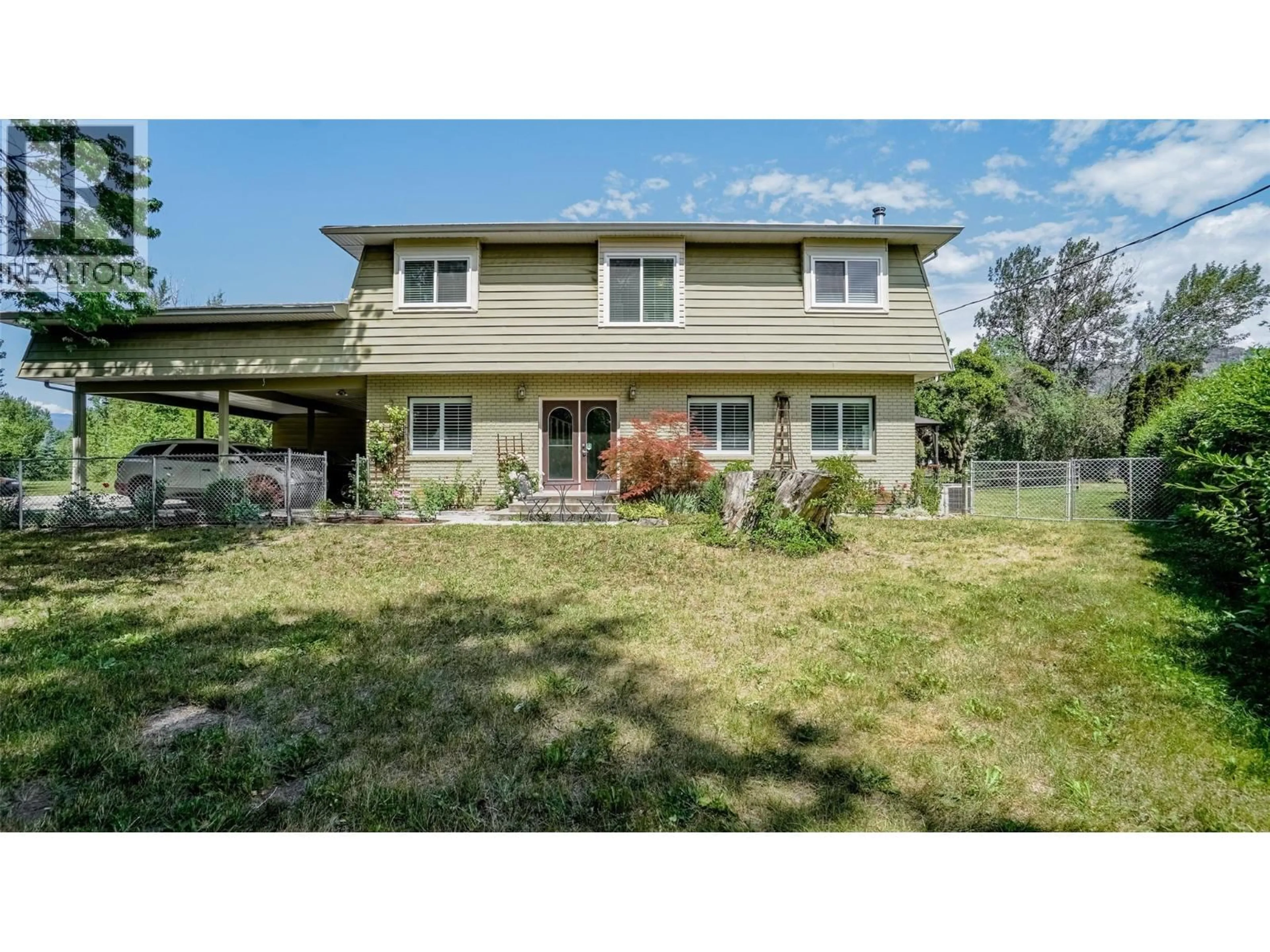 Home with vinyl exterior material, street for 205 GREASEWOOD AVENUE, Oliver British Columbia V0H1T1