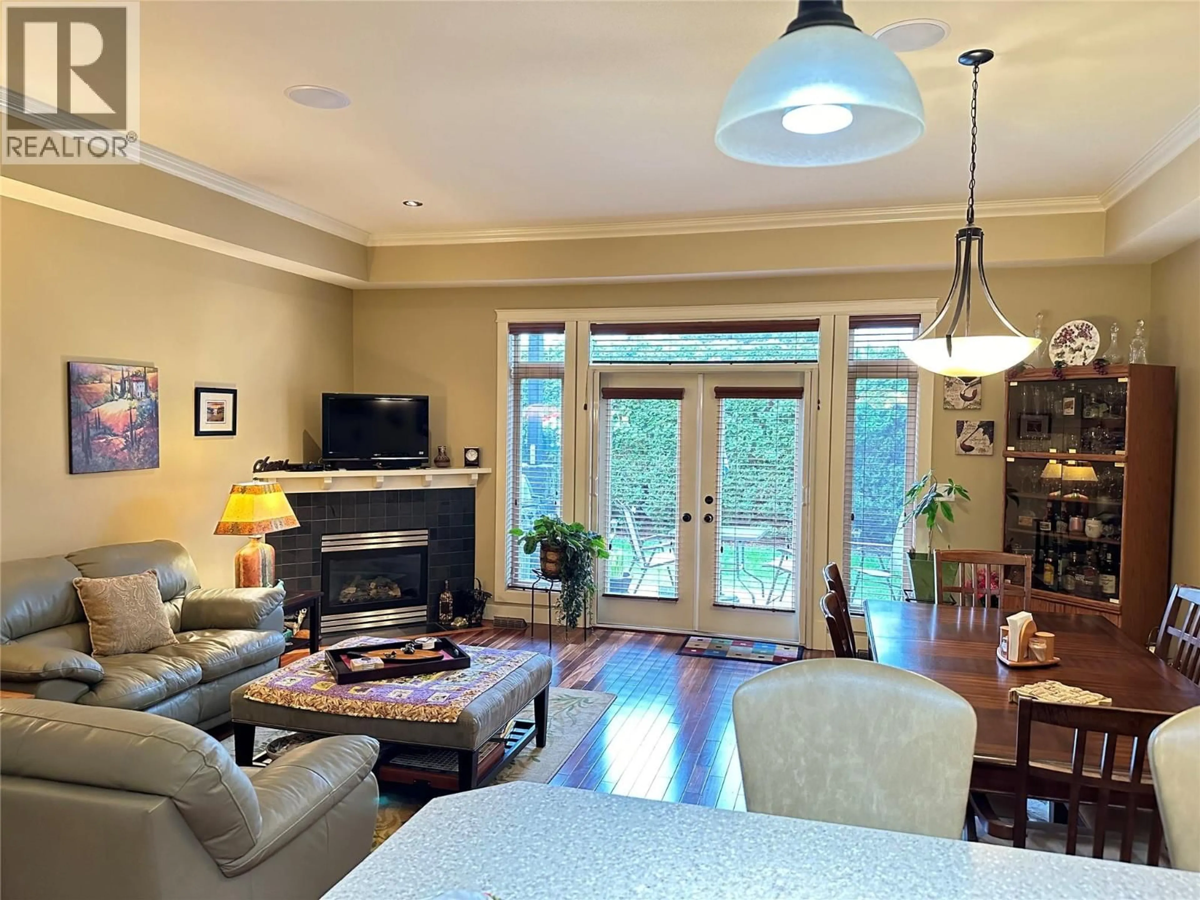 Living room with furniture, wood/laminate floor for 109 - 2629 CORNWALL DRIVE, Penticton British Columbia V2A6J3