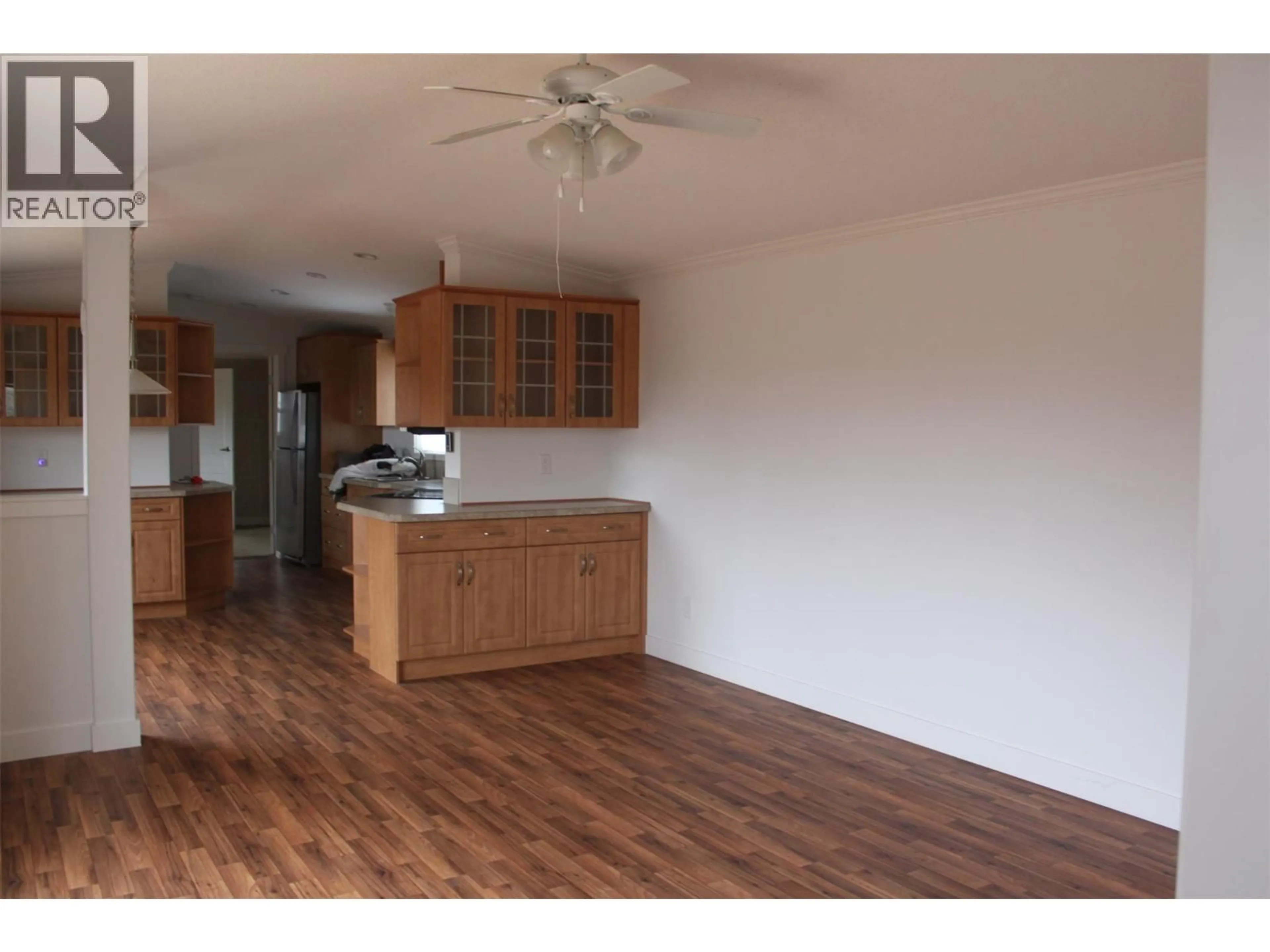 Open concept kitchen, wood/laminate floor for 450 BROUSE LOOP ROAD, Nakusp British Columbia V0G1R1