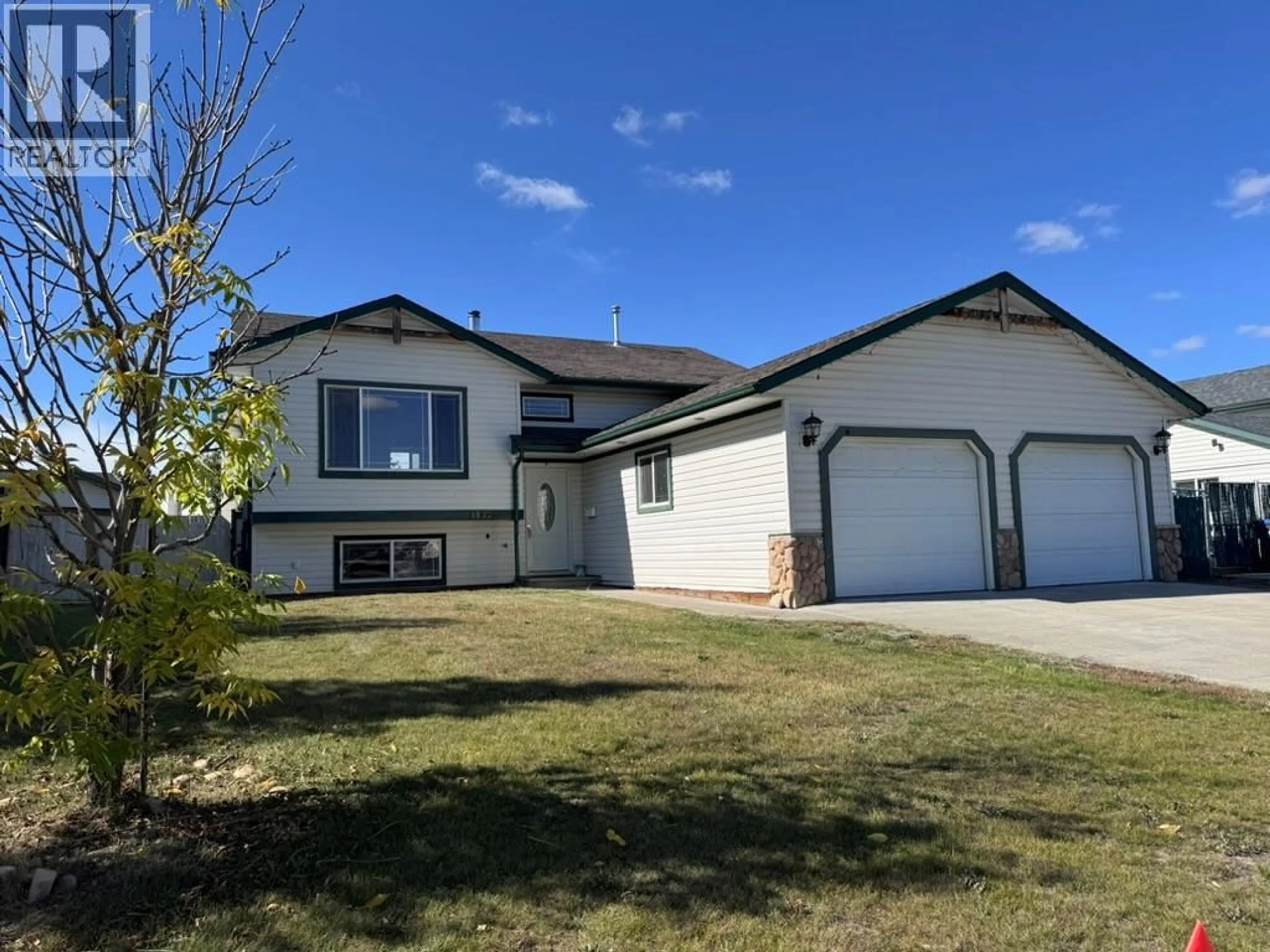 Home with vinyl exterior material, street for 1832 WILLOWBROOK CRESCENT, Dawson Creek British Columbia V1G2P9