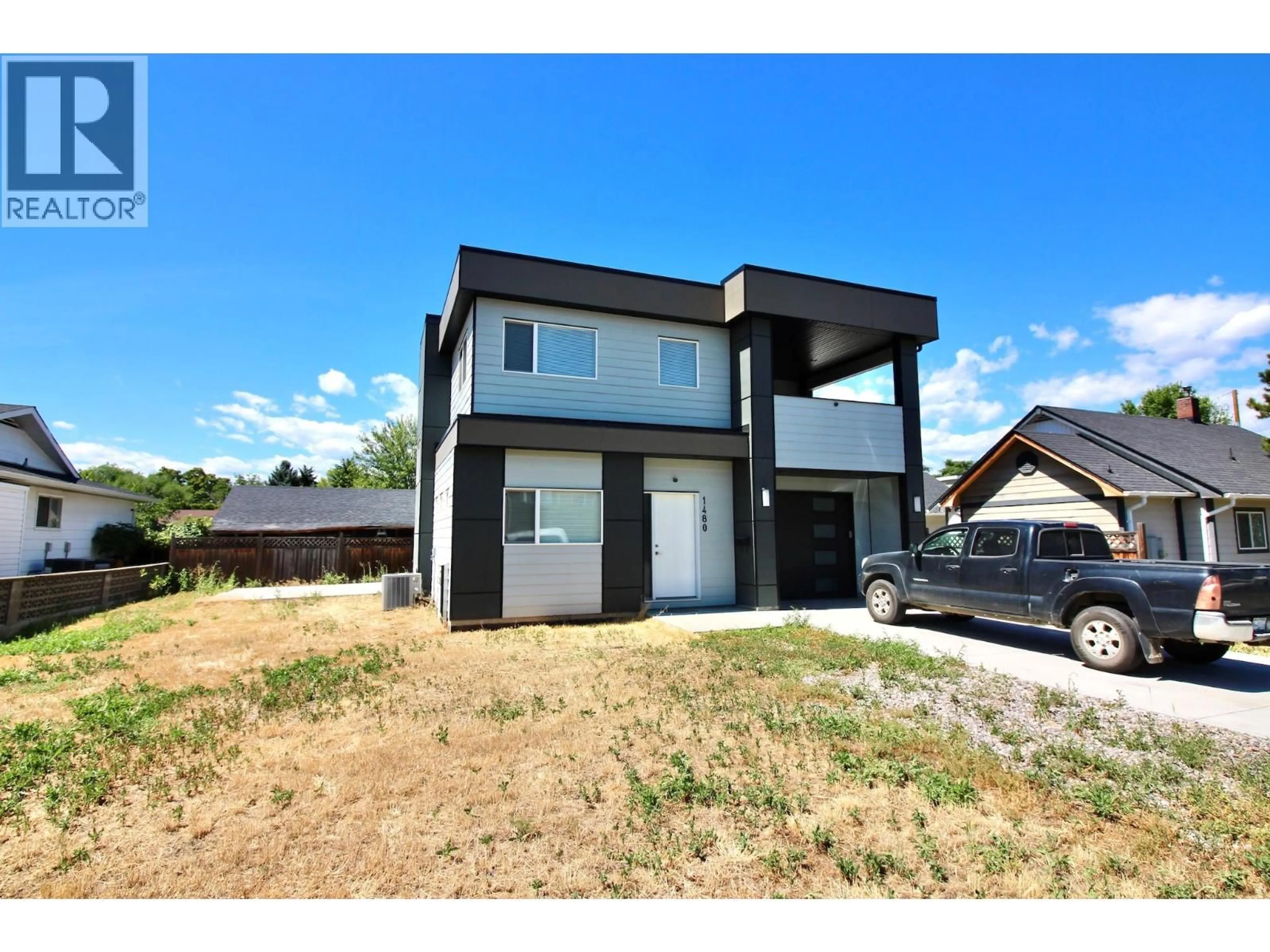 Home with brick exterior material, street for 1480 INKAR ROAD, Kelowna British Columbia V1Y5W1
