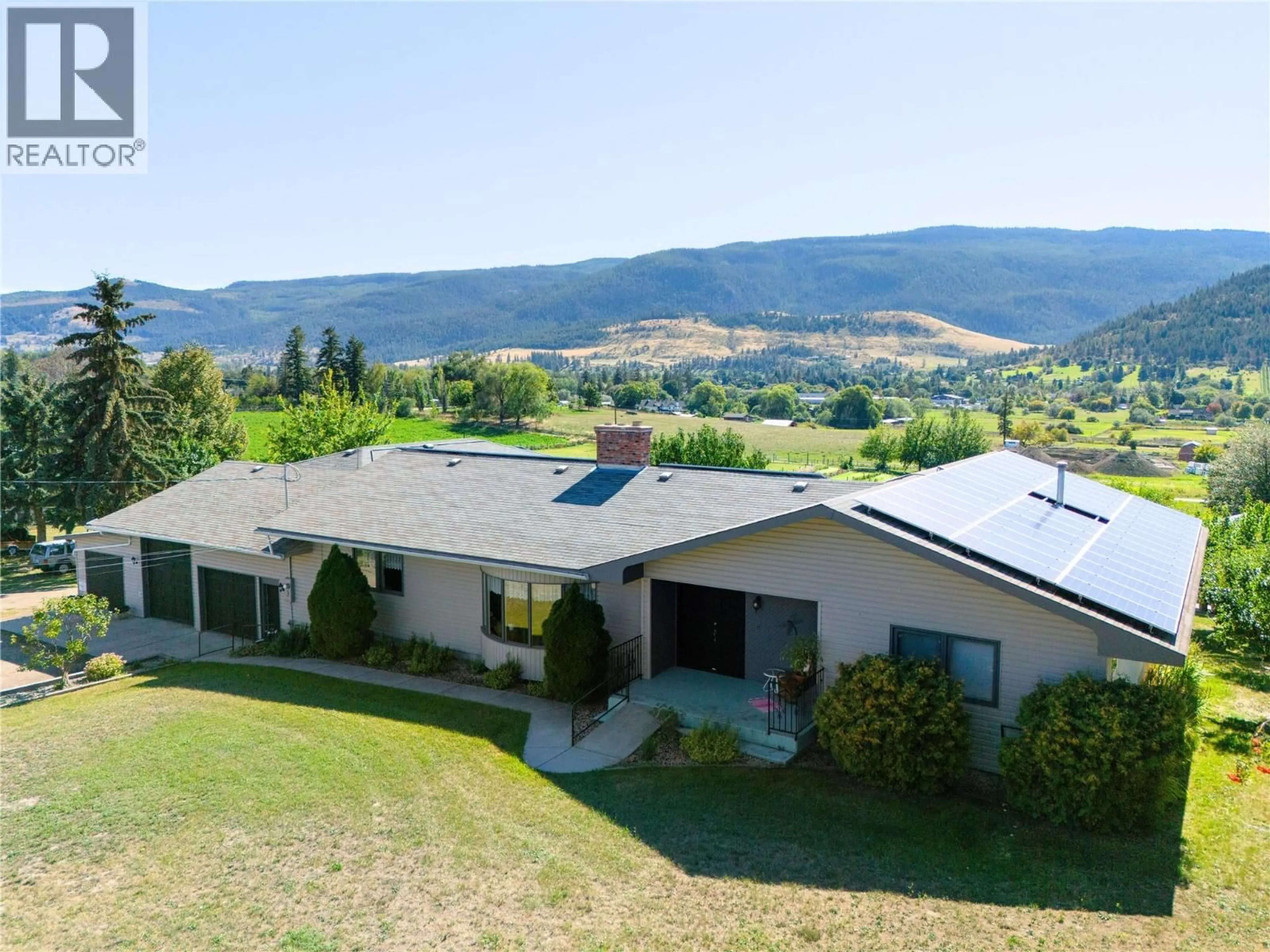 A pic from outside/outdoor area/front of a property/back of a property/a pic from drone, mountain view for 10108 VENABLES DRIVE, Coldstream British Columbia V1B2J9