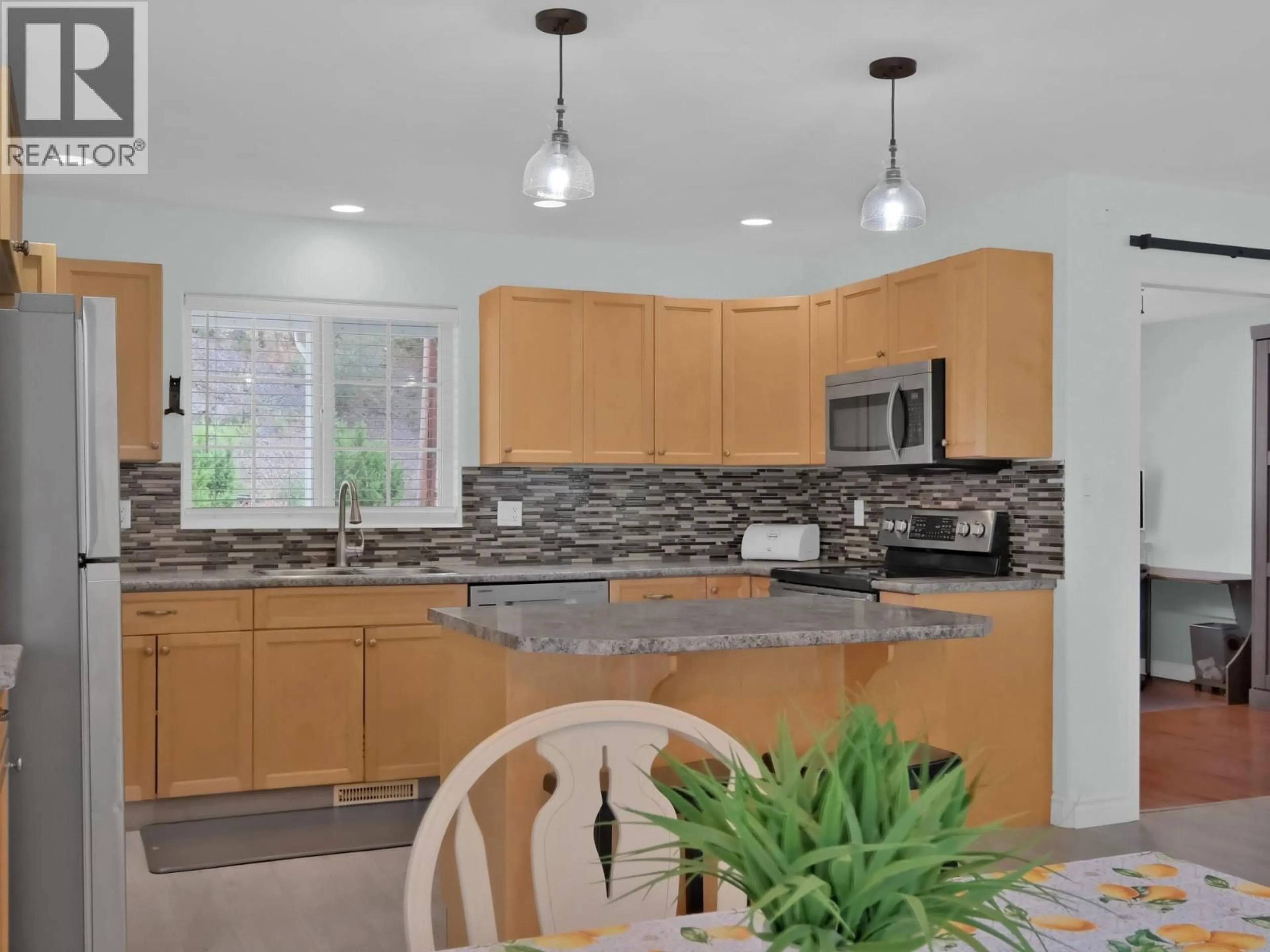 Open concept kitchen, ceramic/tile floor for 7200 VICTORIA ROAD SOUTH, Summerland British Columbia V0H1Z2