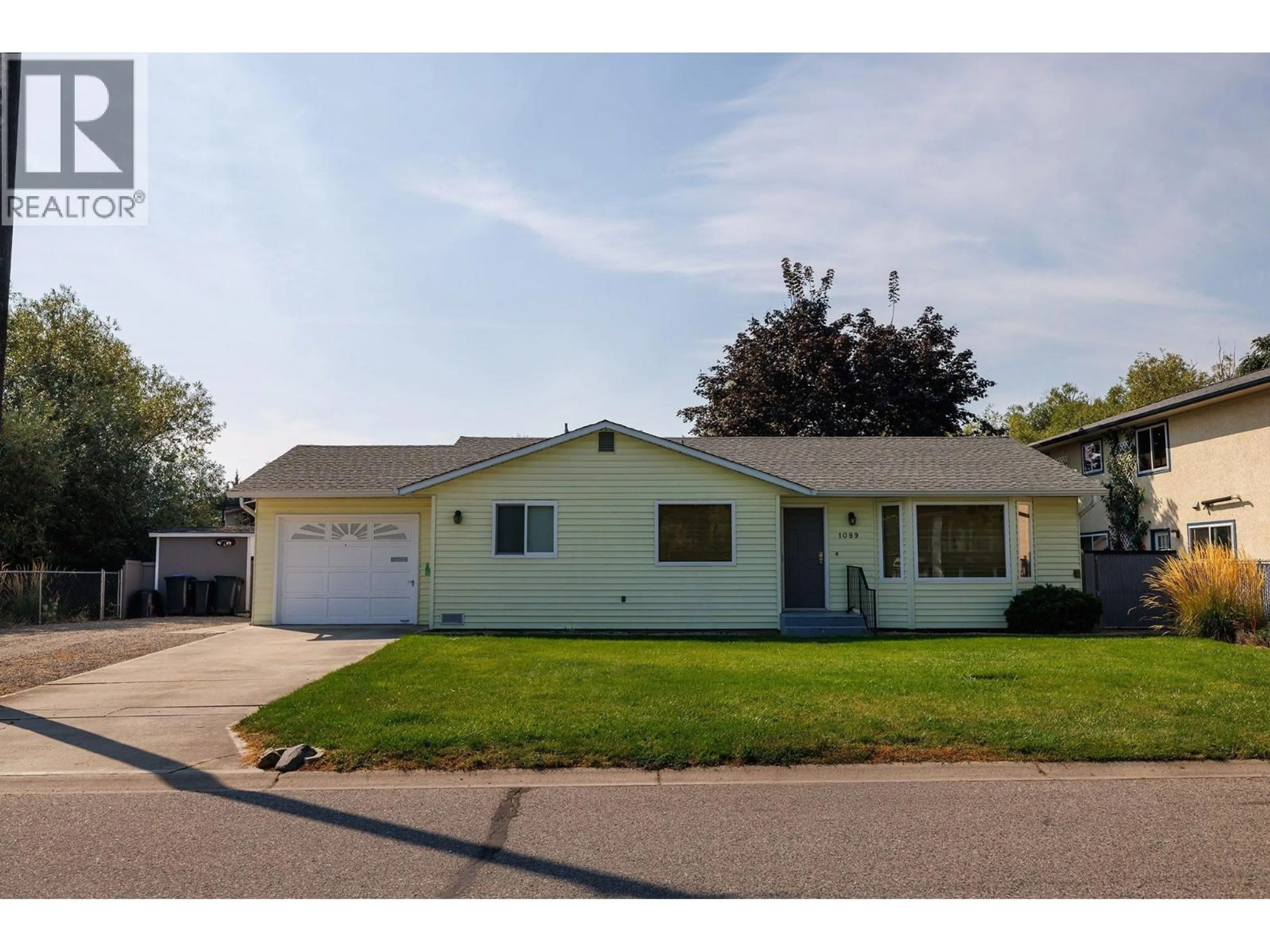 Home with vinyl exterior material, street for 1089 QUESNEL ROAD, Kelowna British Columbia V1Y3J4