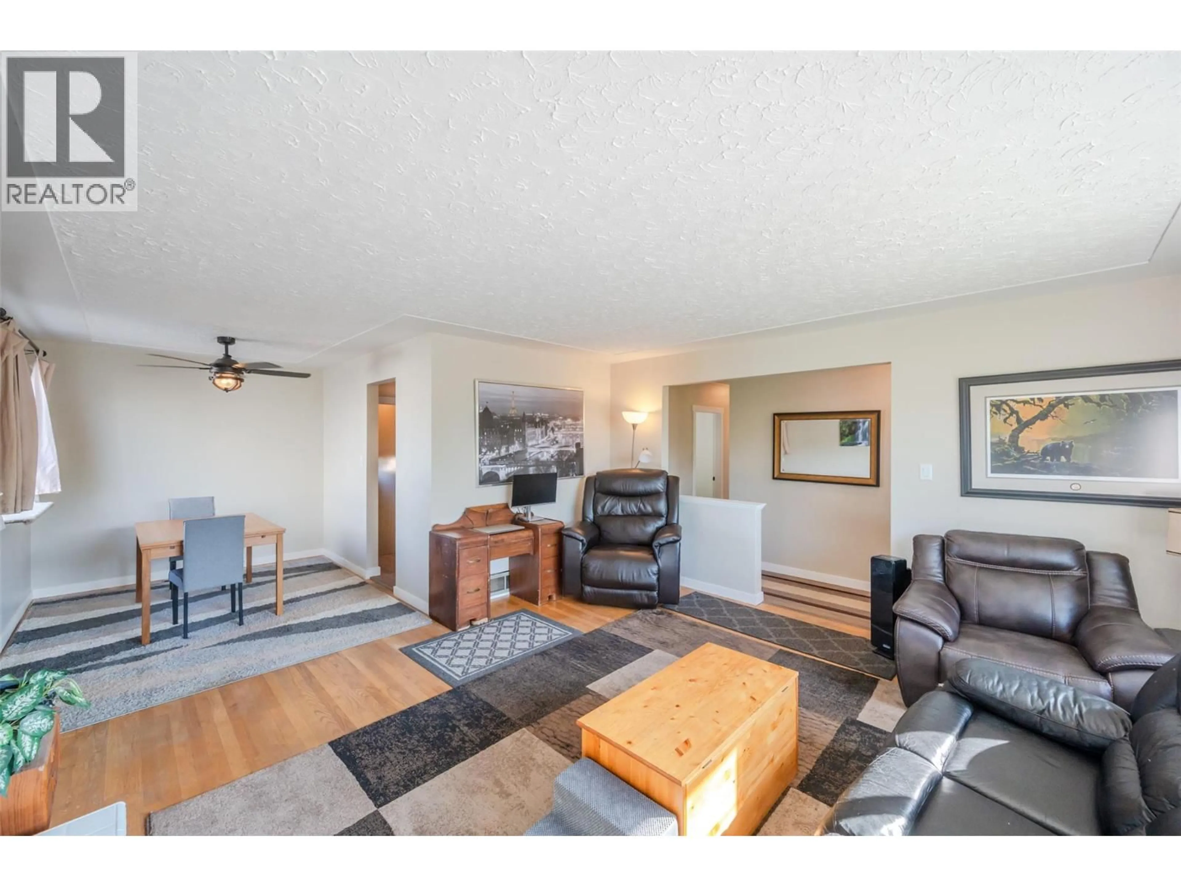 Living room with furniture, wood/laminate floor for 205 MANOR PARK AVE. AVENUE, Penticton British Columbia V2A2R1