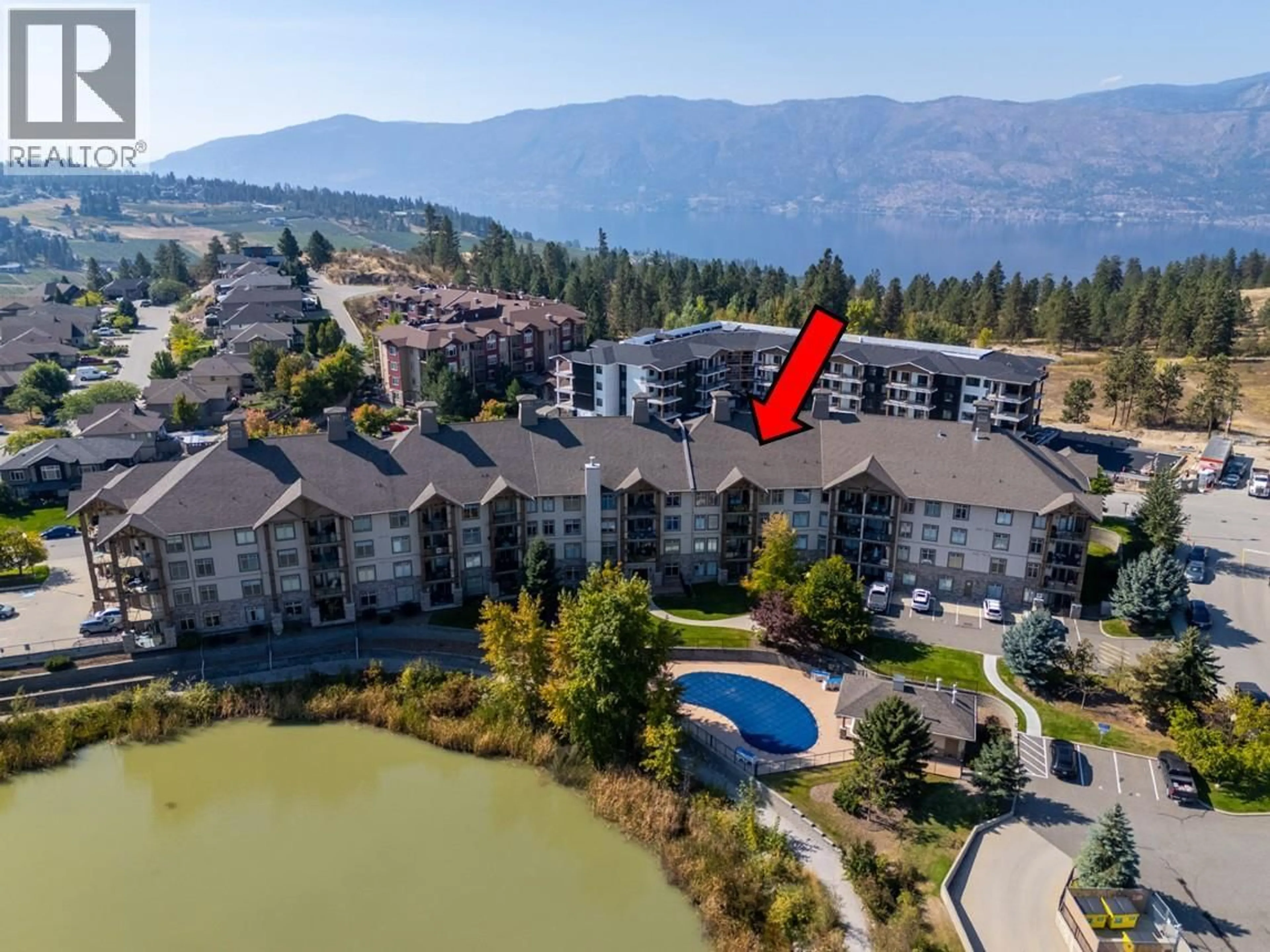 A pic from outside/outdoor area/front of a property/back of a property/a pic from drone, water/lake/river/ocean view for 408 - 2551 SHORELINE DRIVE, Lake Country British Columbia V1Y4B4