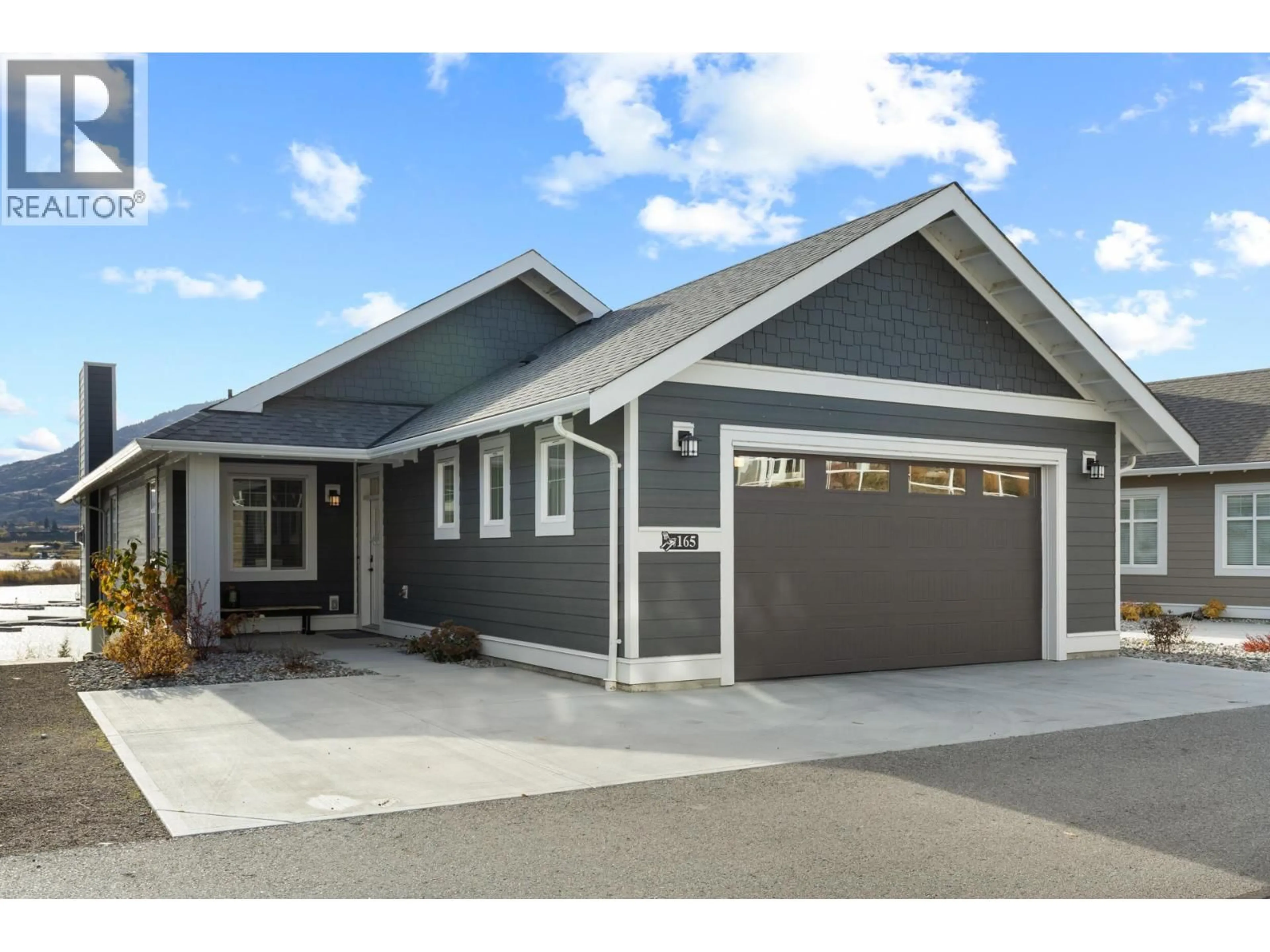 Home with vinyl exterior material, street for 165 - 2450 RADIO TOWER ROAD, Osoyoos British Columbia V0H1T1