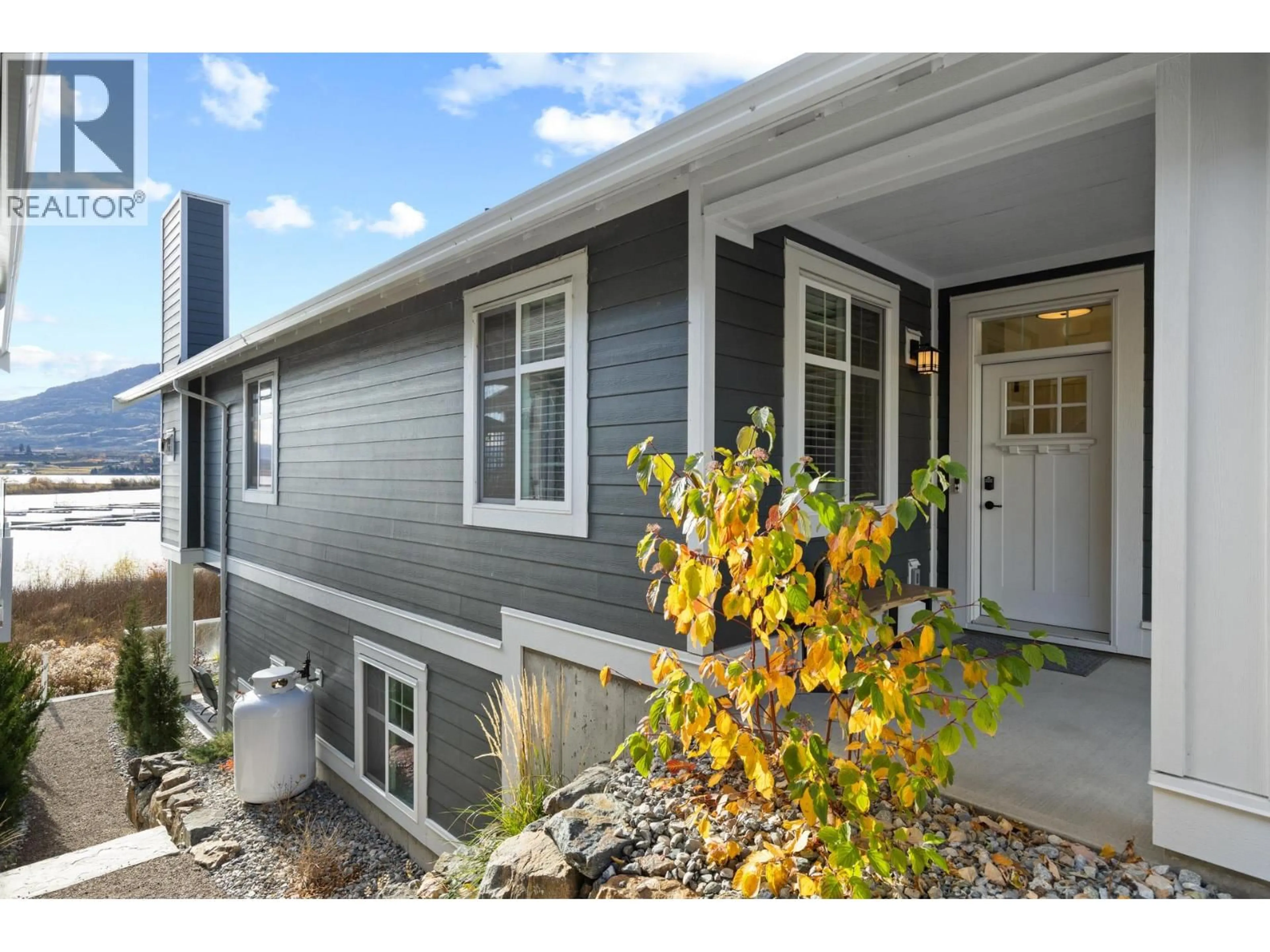 Home with vinyl exterior material, street for 165 - 2450 RADIO TOWER ROAD, Osoyoos British Columbia V0H1T1