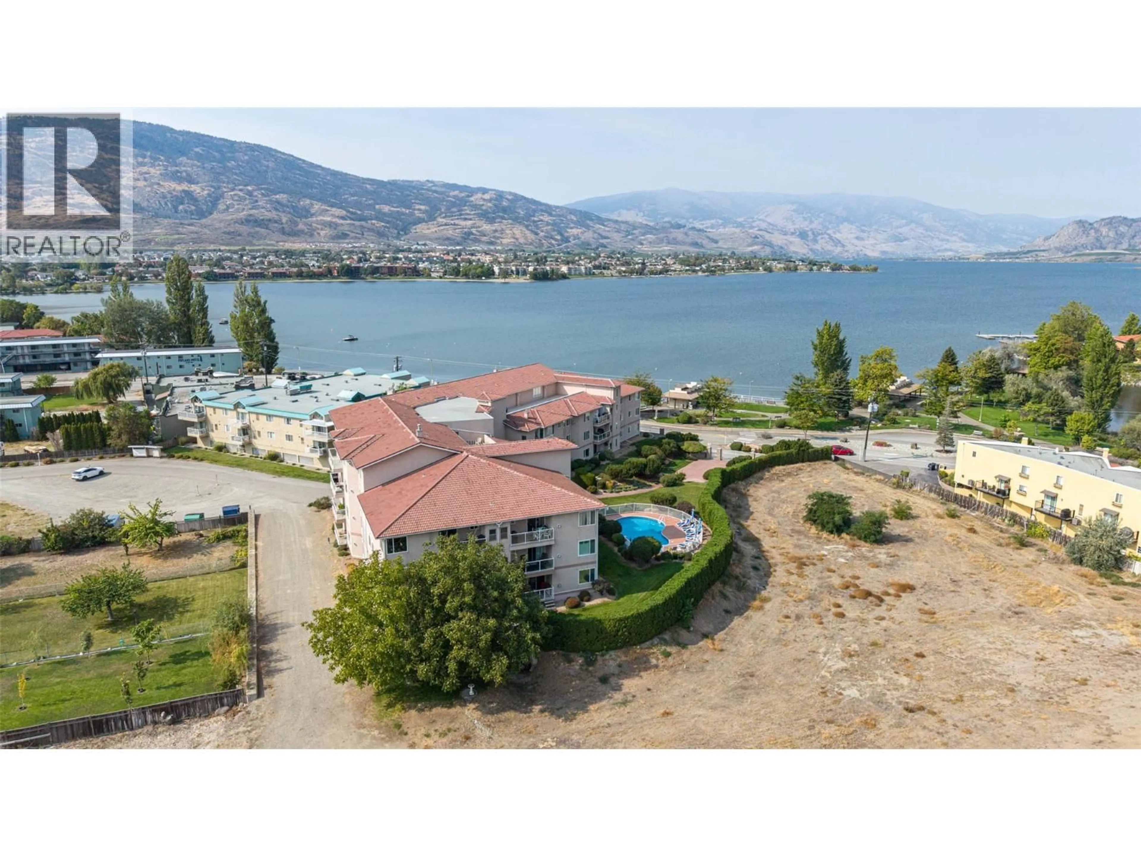 A pic from outside/outdoor area/front of a property/back of a property/a pic from drone, water/lake/river/ocean view for 300 - 6805 COTTONWOOD DRIVE, Osoyoos British Columbia V0H1V3