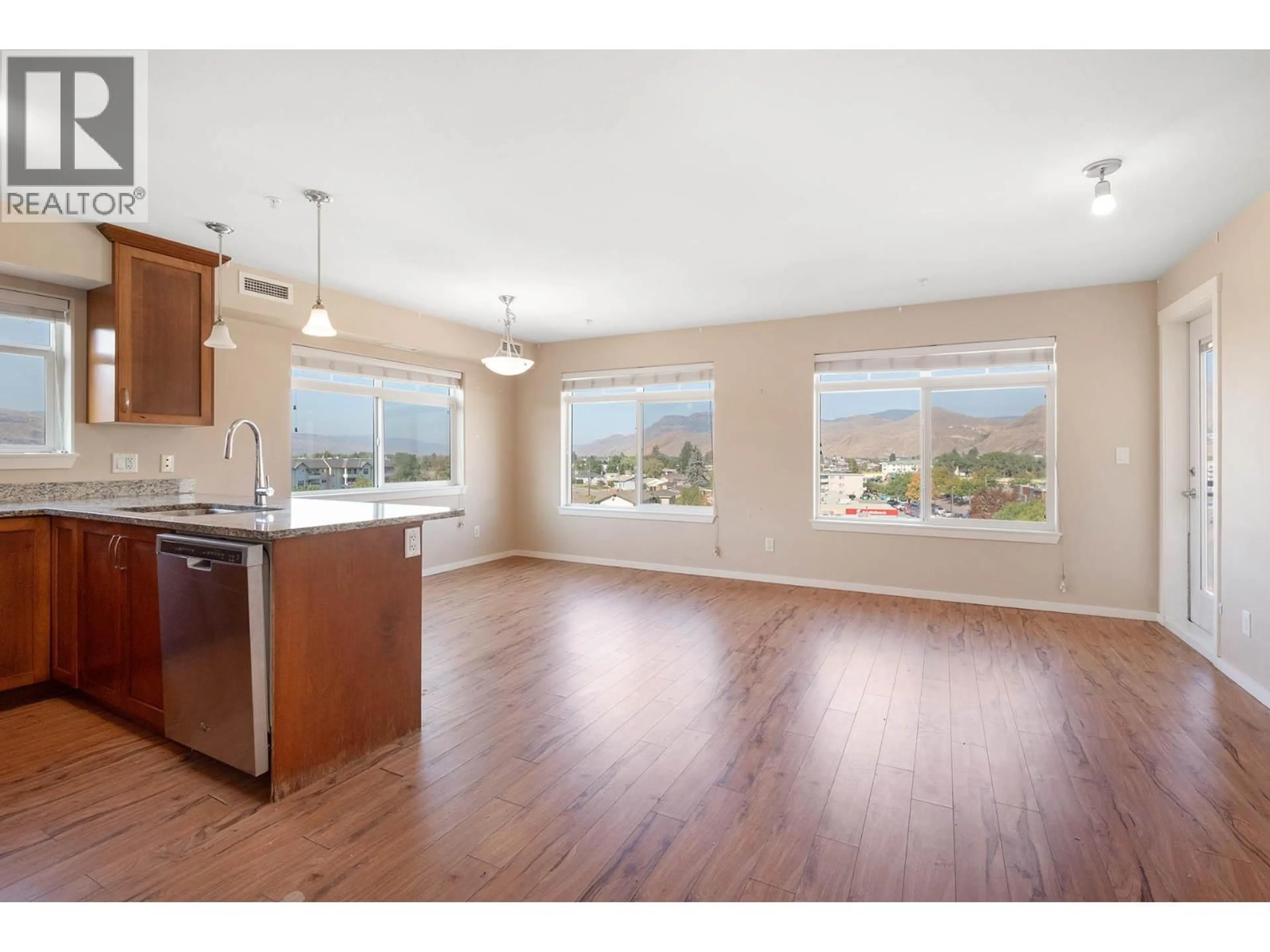 Open concept kitchen, wood/laminate floor for 520 - 689 TRANQUILLE ROAD, Kamloops British Columbia V2B0C7