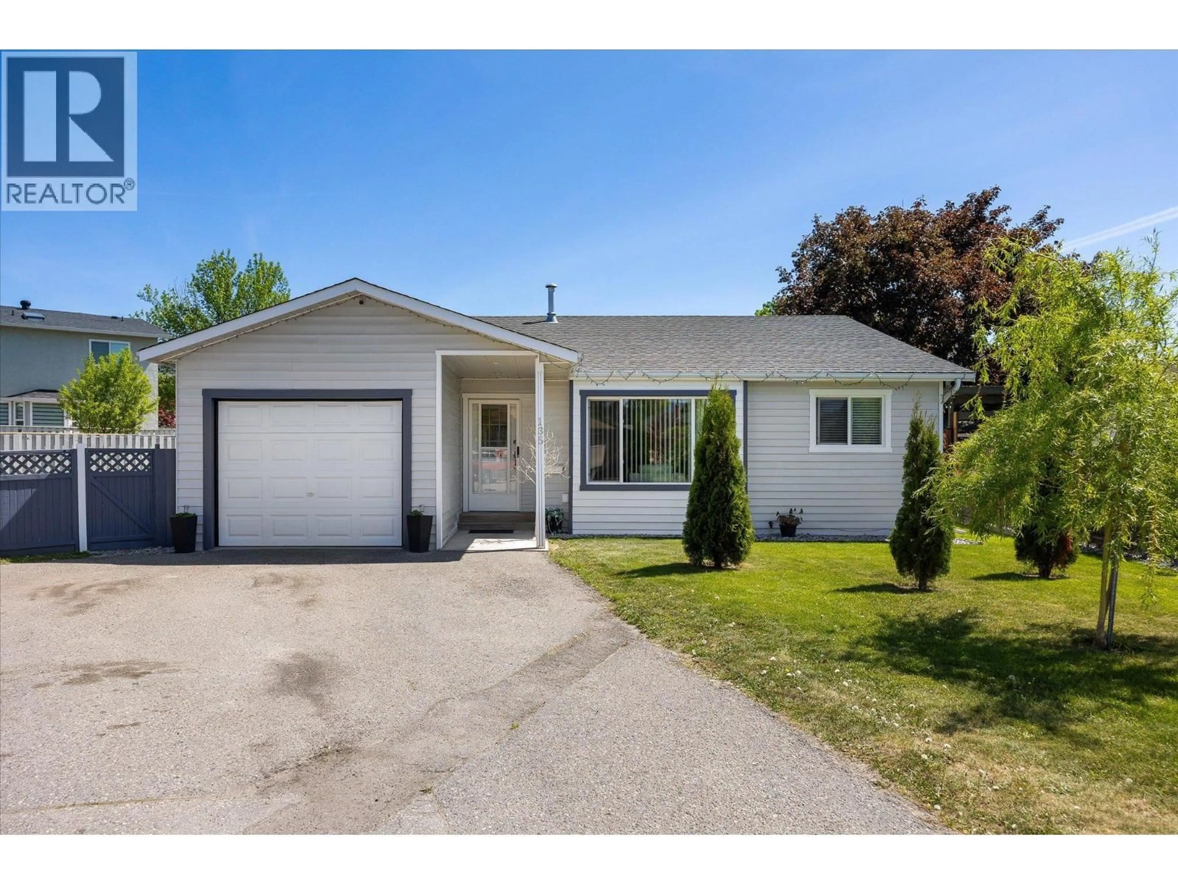 Home with vinyl exterior material, street for 135 ALMOND COURT, Kelowna British Columbia V1X6H1