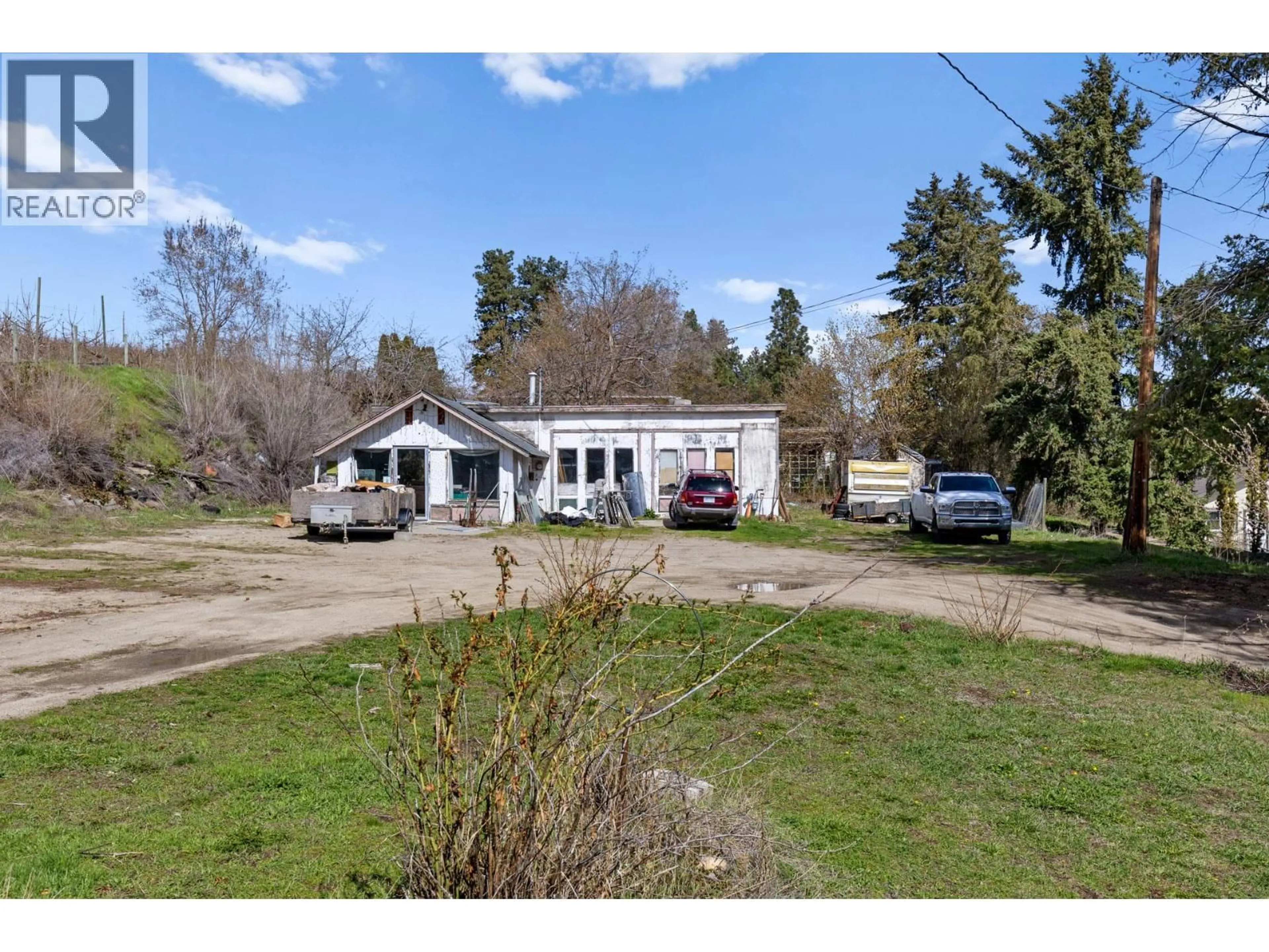 A pic from outside/outdoor area/front of a property/back of a property/a pic from drone, street for 10114 NEWENE ROAD, Lake Country British Columbia V4V1V2