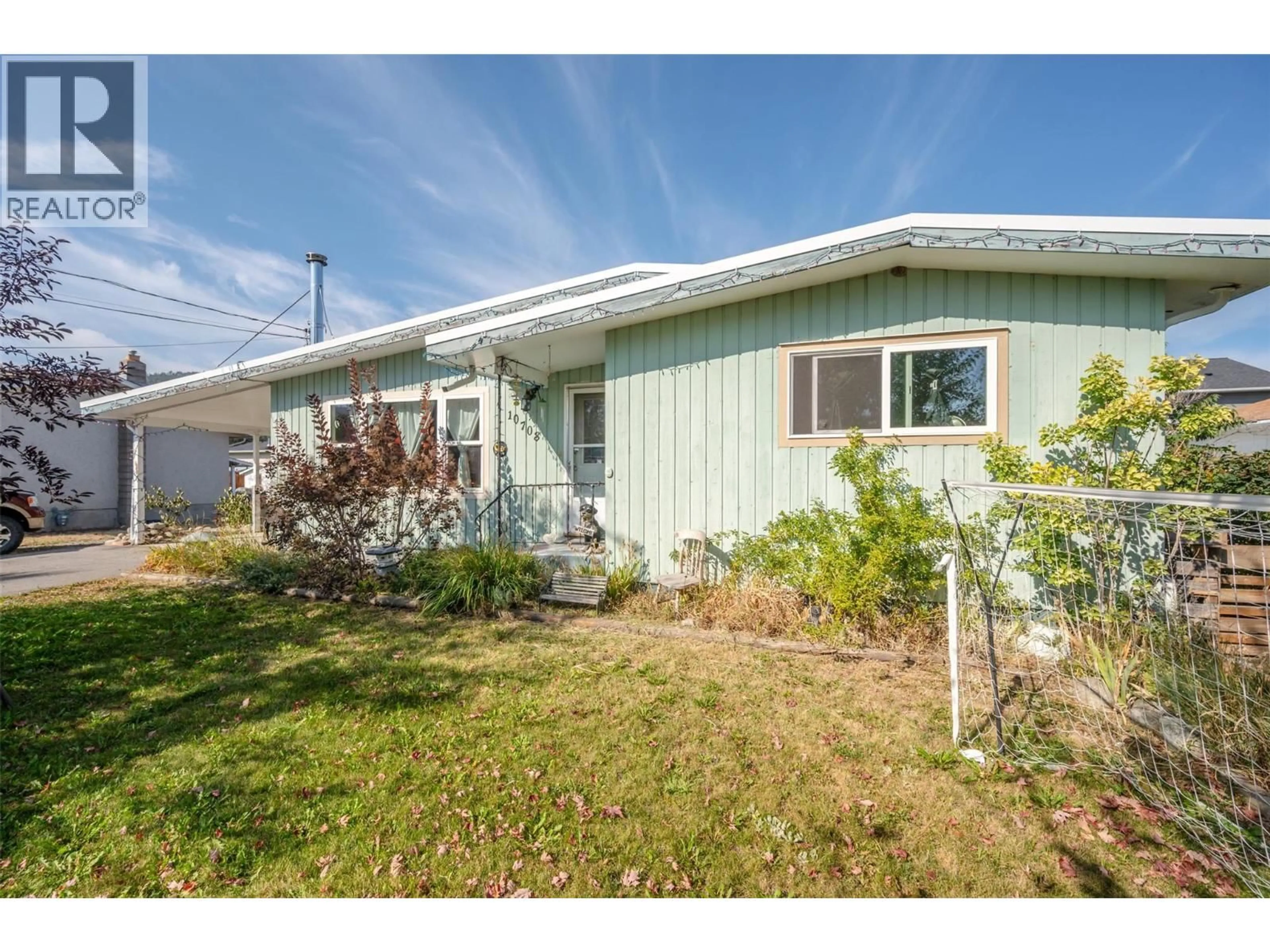 Home with vinyl exterior material, street for 10708 PRAIRIE VALLEY ROAD, Summerland British Columbia V0H1Z8