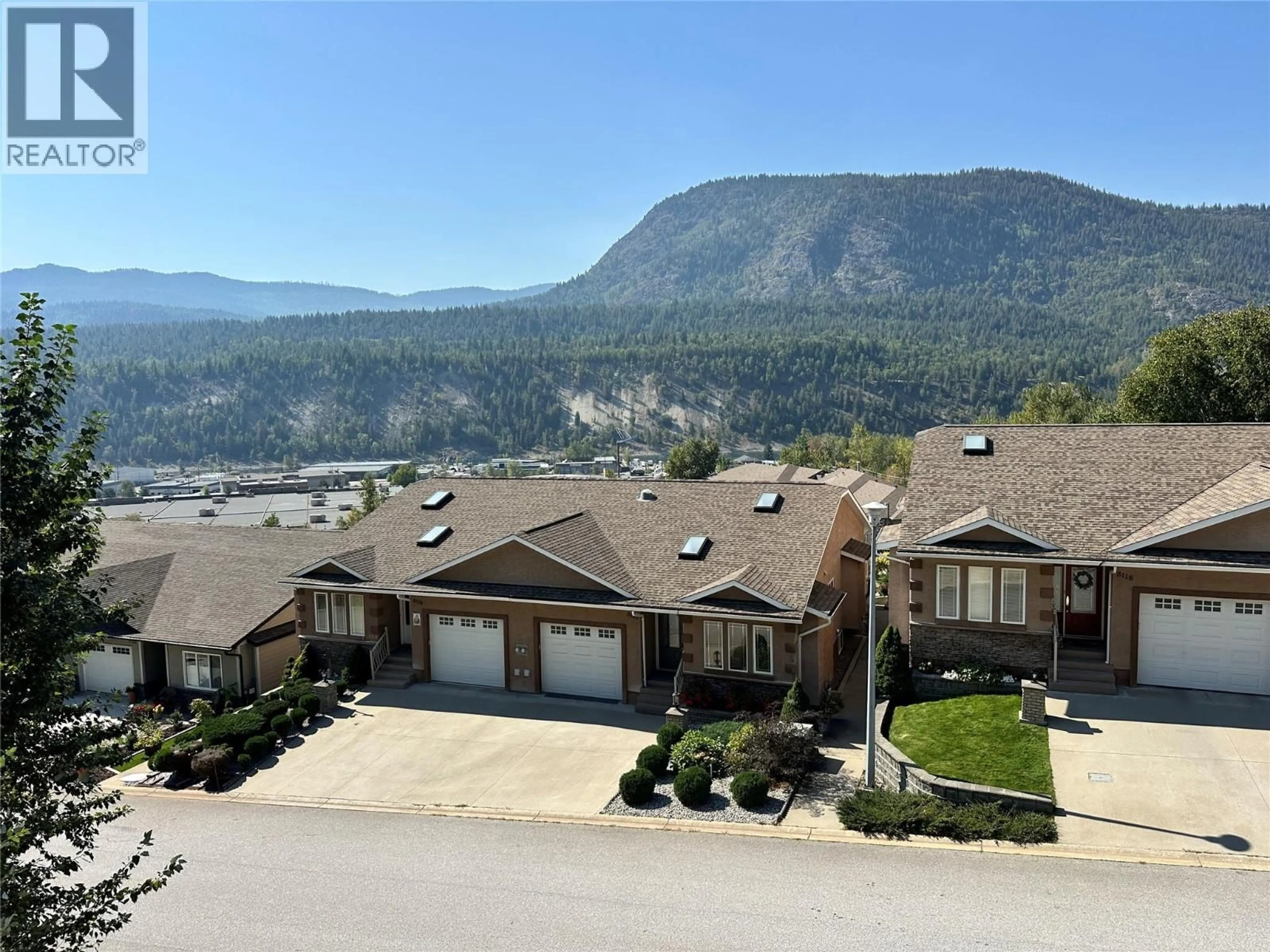 A pic from outside/outdoor area/front of a property/back of a property/a pic from drone, mountain view for 8121 BIRCHWOOD DRIVE, Trail British Columbia V1R4Y3