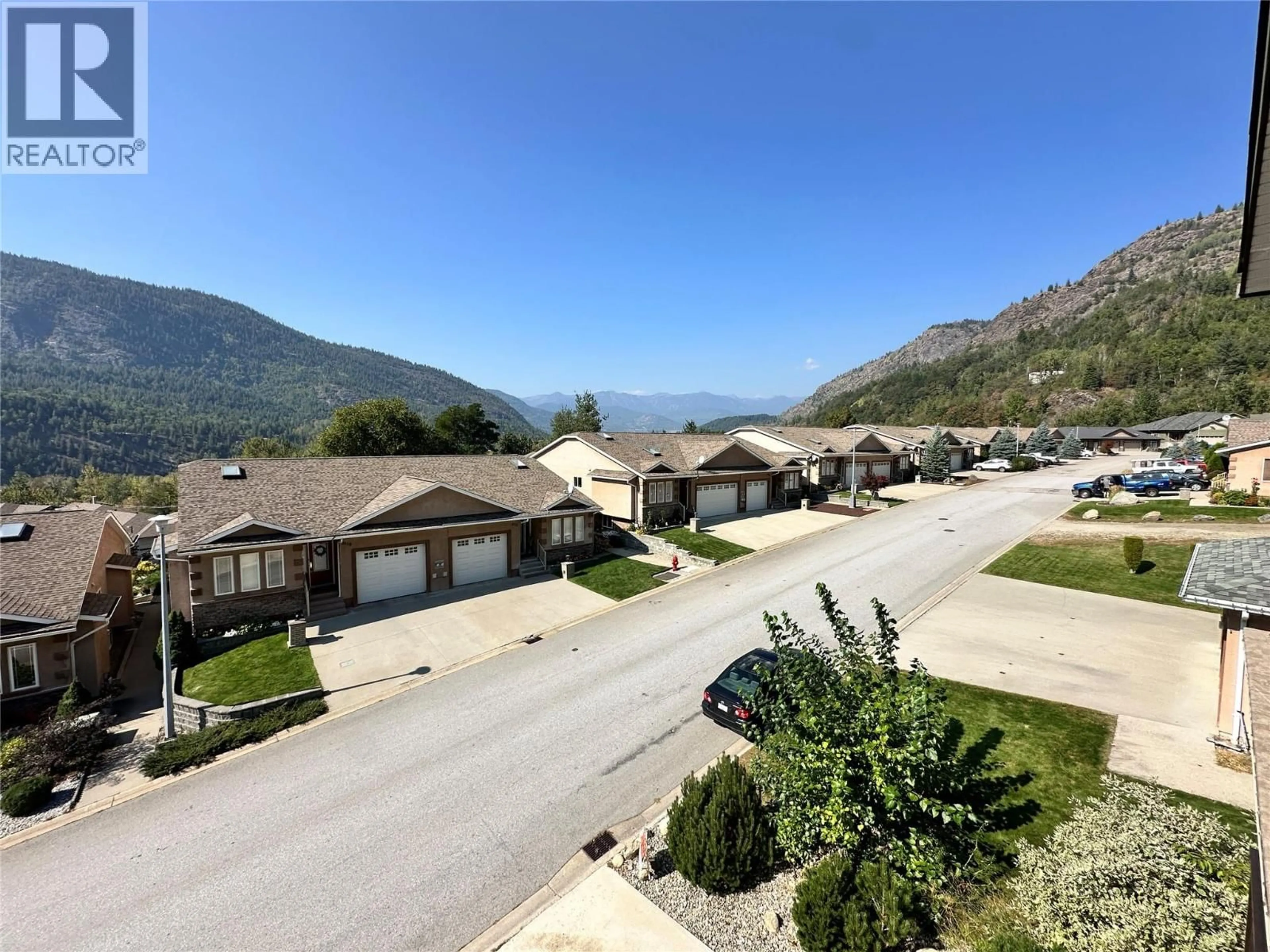 A pic from outside/outdoor area/front of a property/back of a property/a pic from drone, mountain view for 8121 BIRCHWOOD DRIVE, Trail British Columbia V1R4Y3