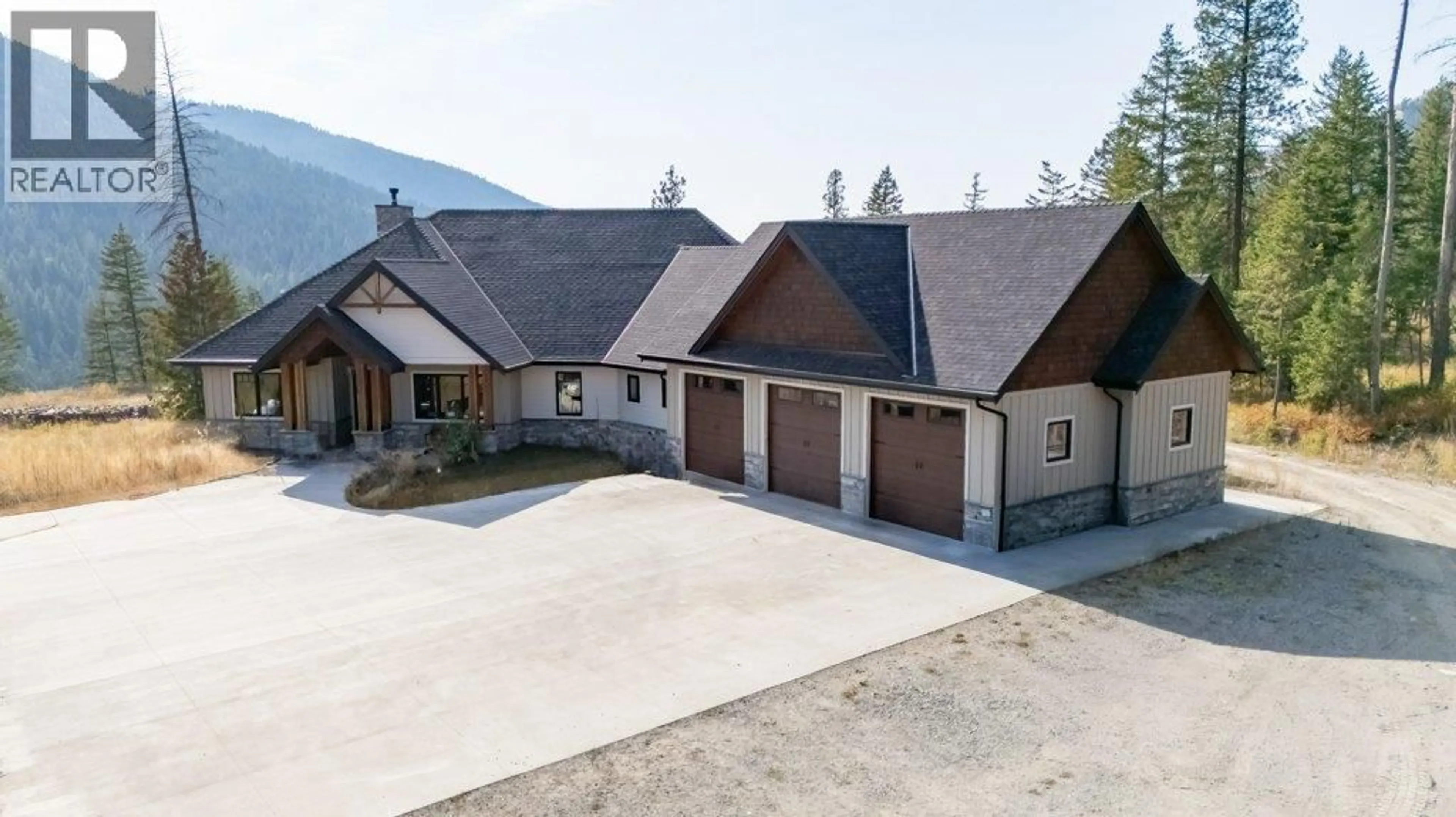 A pic from outside/outdoor area/front of a property/back of a property/a pic from drone, mountain view for 7839 FALCON RIDGE CRESCENT, Kelowna British Columbia V1P1J2