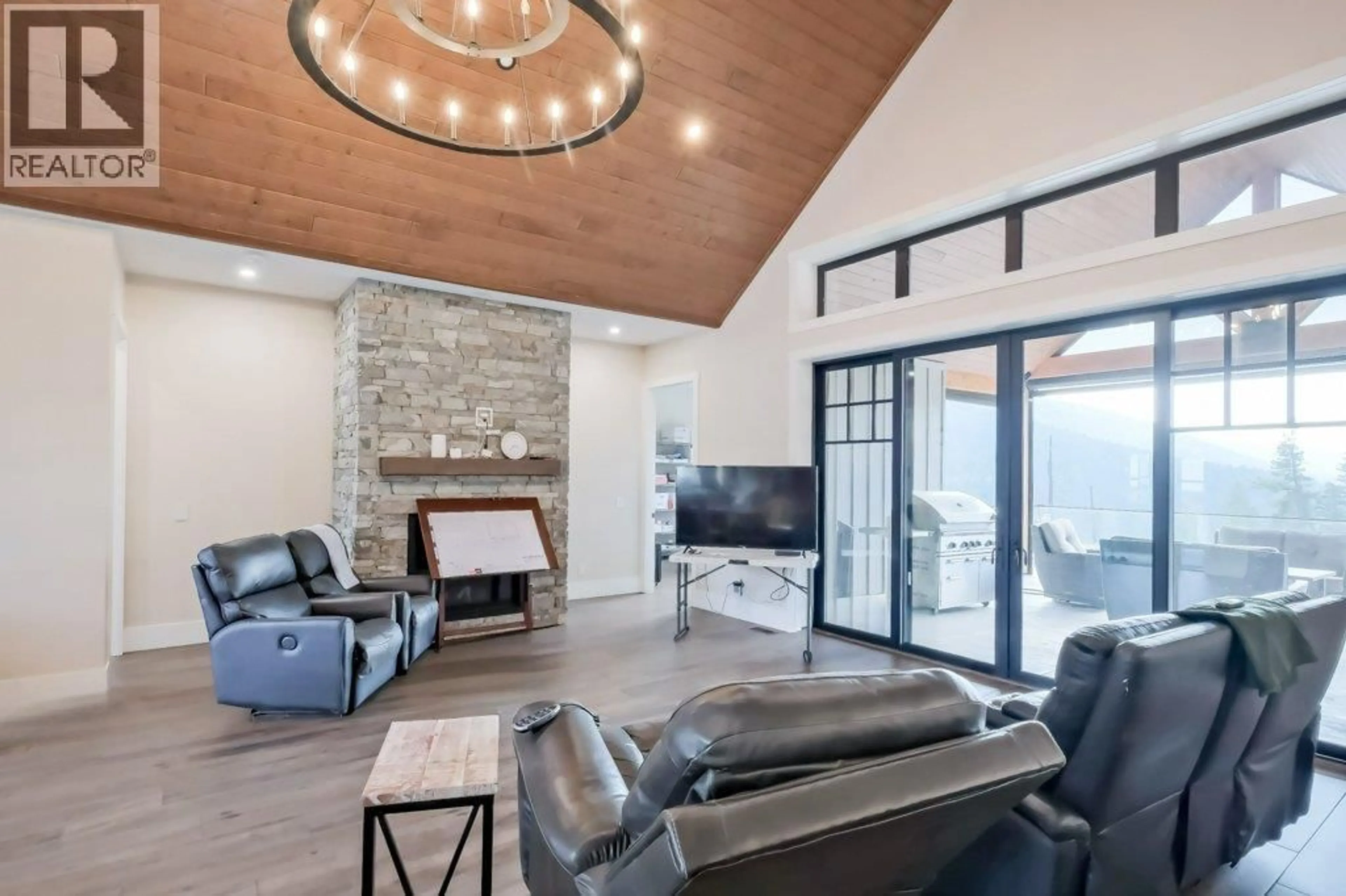 Living room with furniture, unknown for 7839 FALCON RIDGE CRESCENT, Kelowna British Columbia V1P1J2