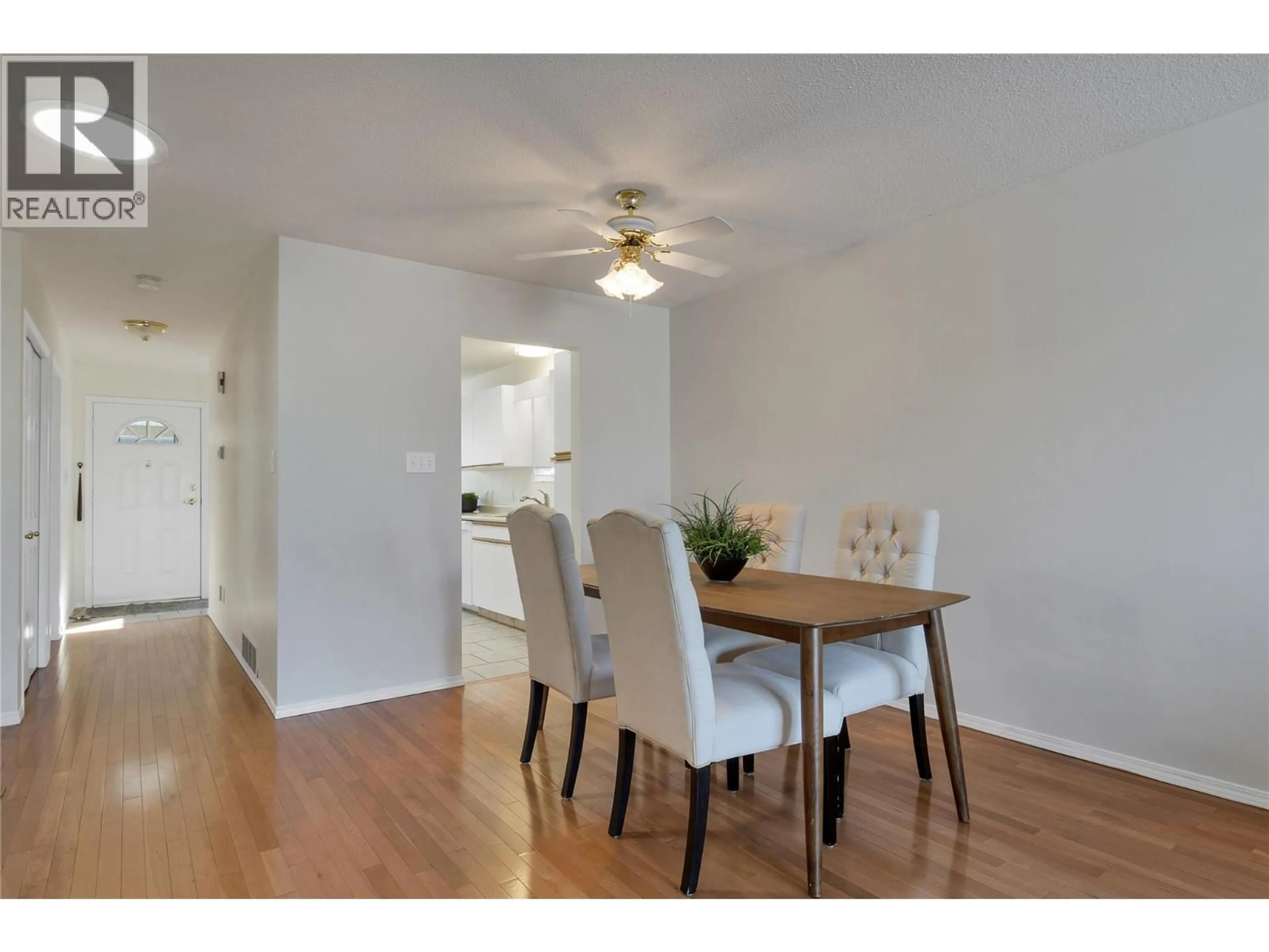 Dining room, wood/laminate floor for 10 - 3906 PLEASANT VALLEY ROAD, Vernon British Columbia V1T4L9