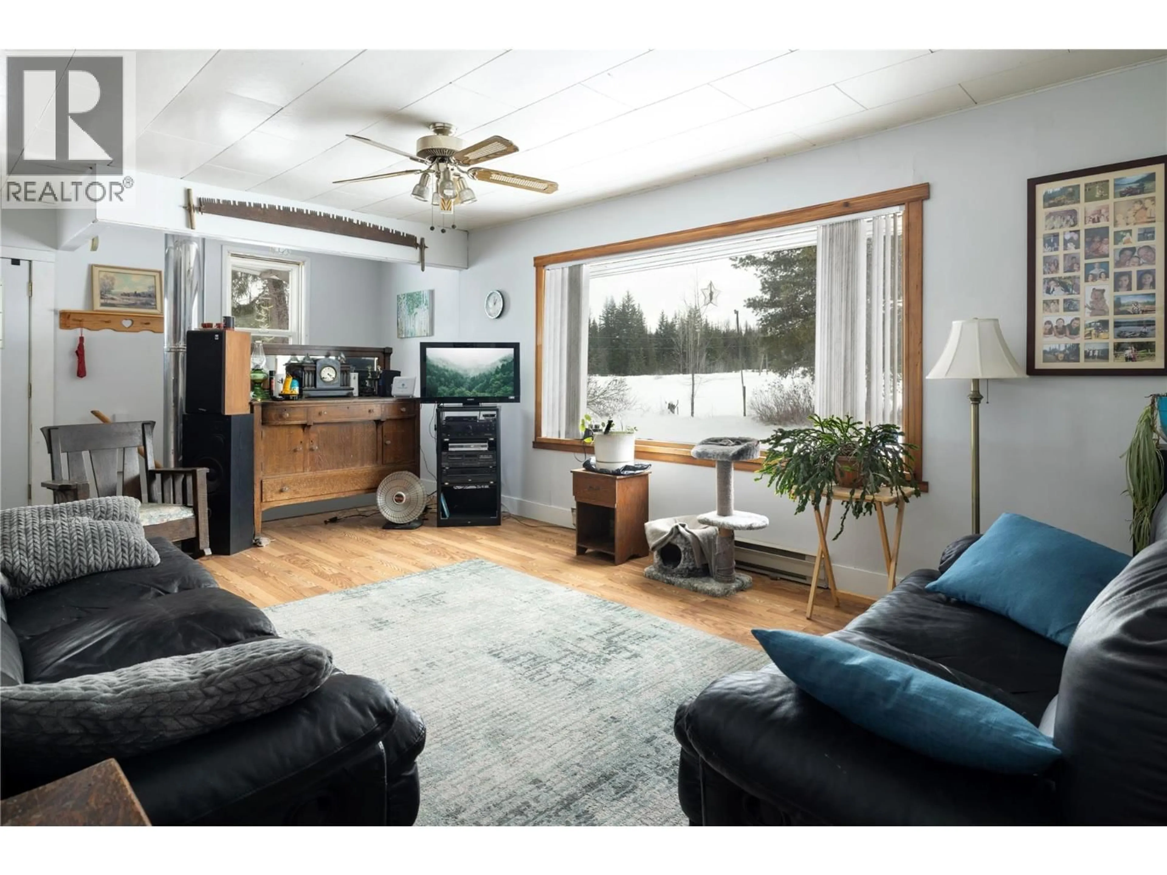 Living room with furniture, wood/laminate floor for 1440 TRINITY VALLEY ROAD, Lumby British Columbia V0E2G0