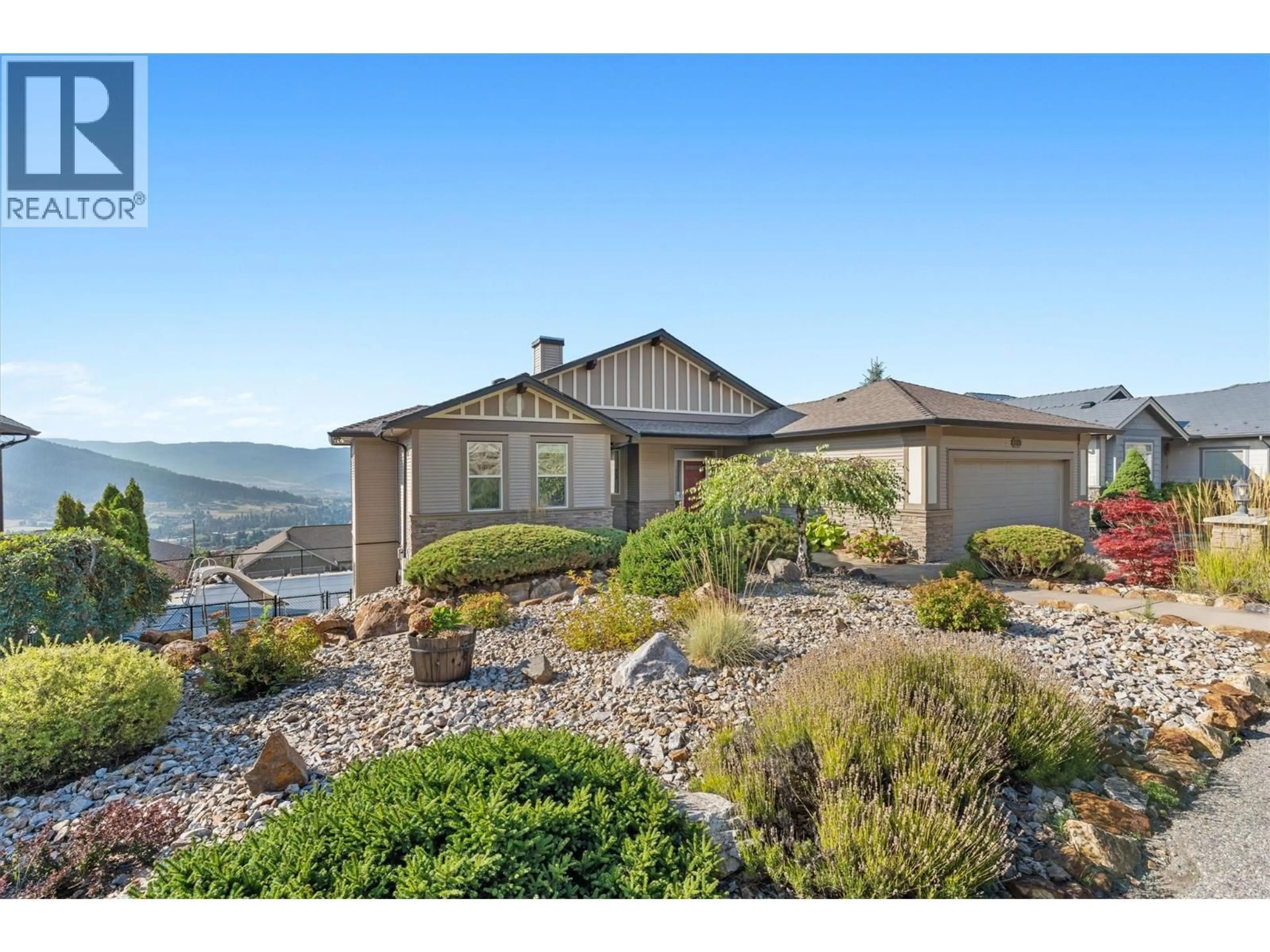 A pic from outside/outdoor area/front of a property/back of a property/a pic from drone, mountain view for 725 HART LANE, Vernon British Columbia V1B4B2