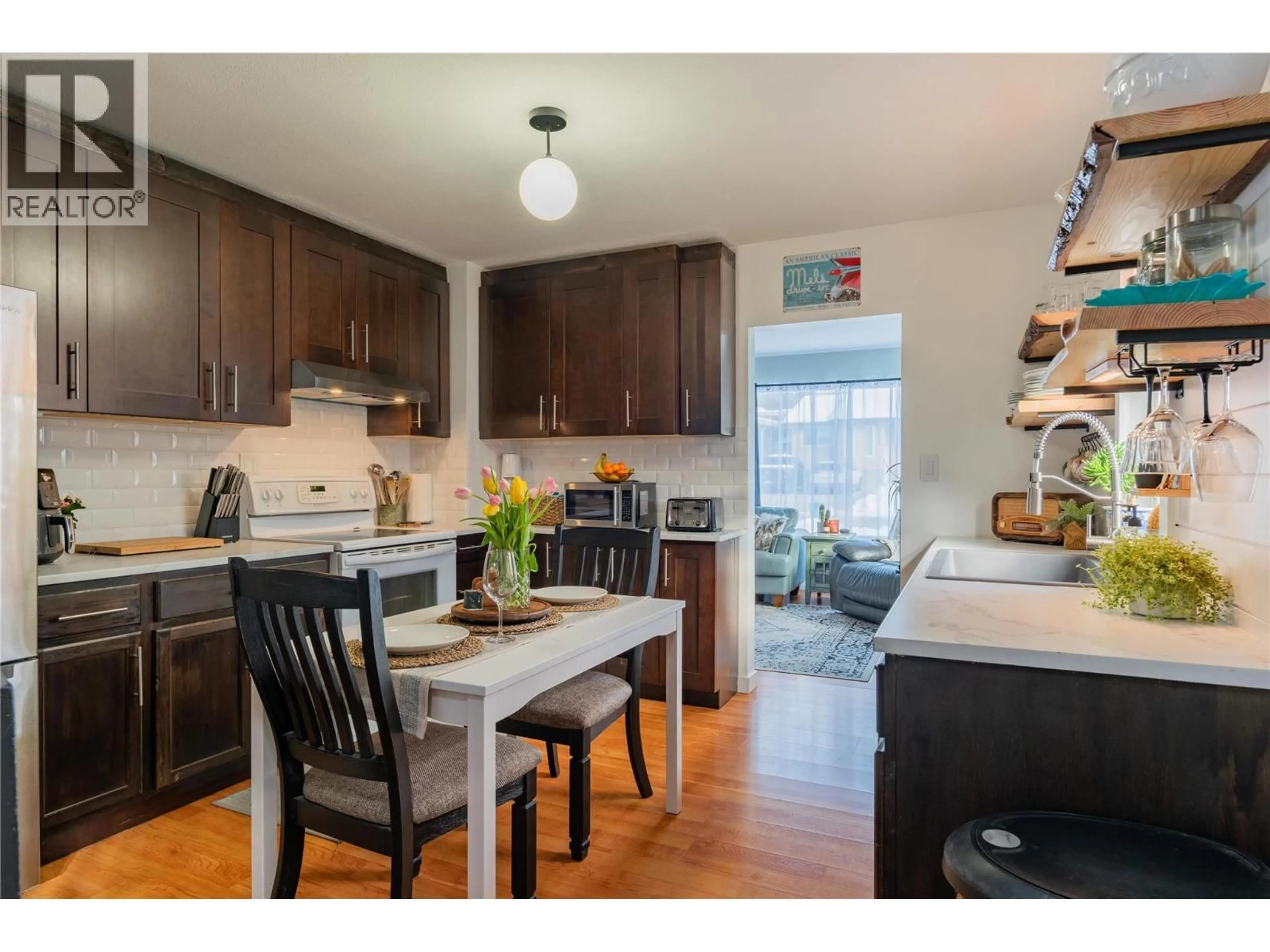 Open concept kitchen, wood/laminate floor for 2130 SEVENTH AVENUE, Trail British Columbia V1R3C6