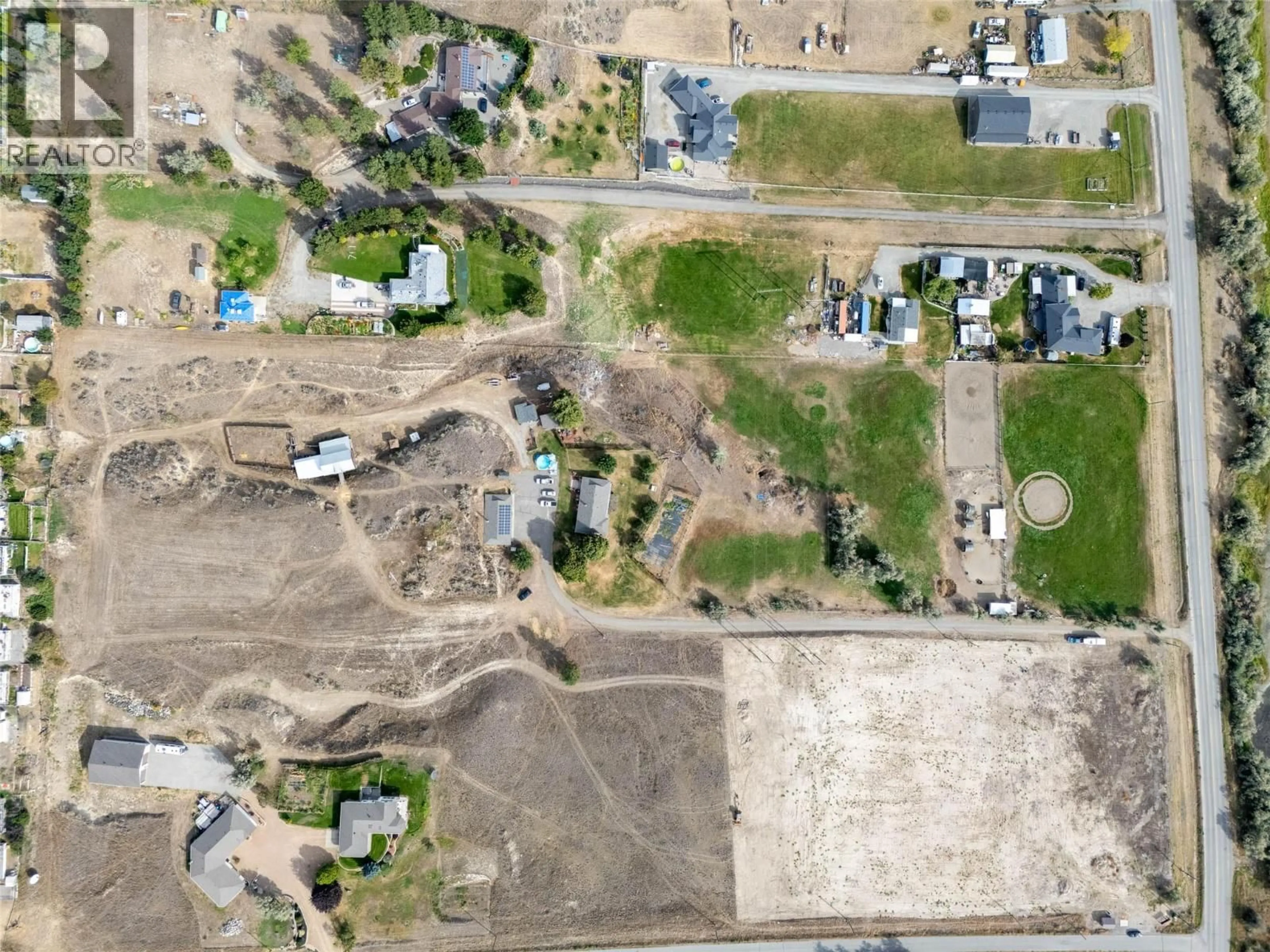 A pic from outside/outdoor area/front of a property/back of a property/a pic from drone, street for 3119 SHUSWAP ROAD, Kamloops British Columbia V2H1T1