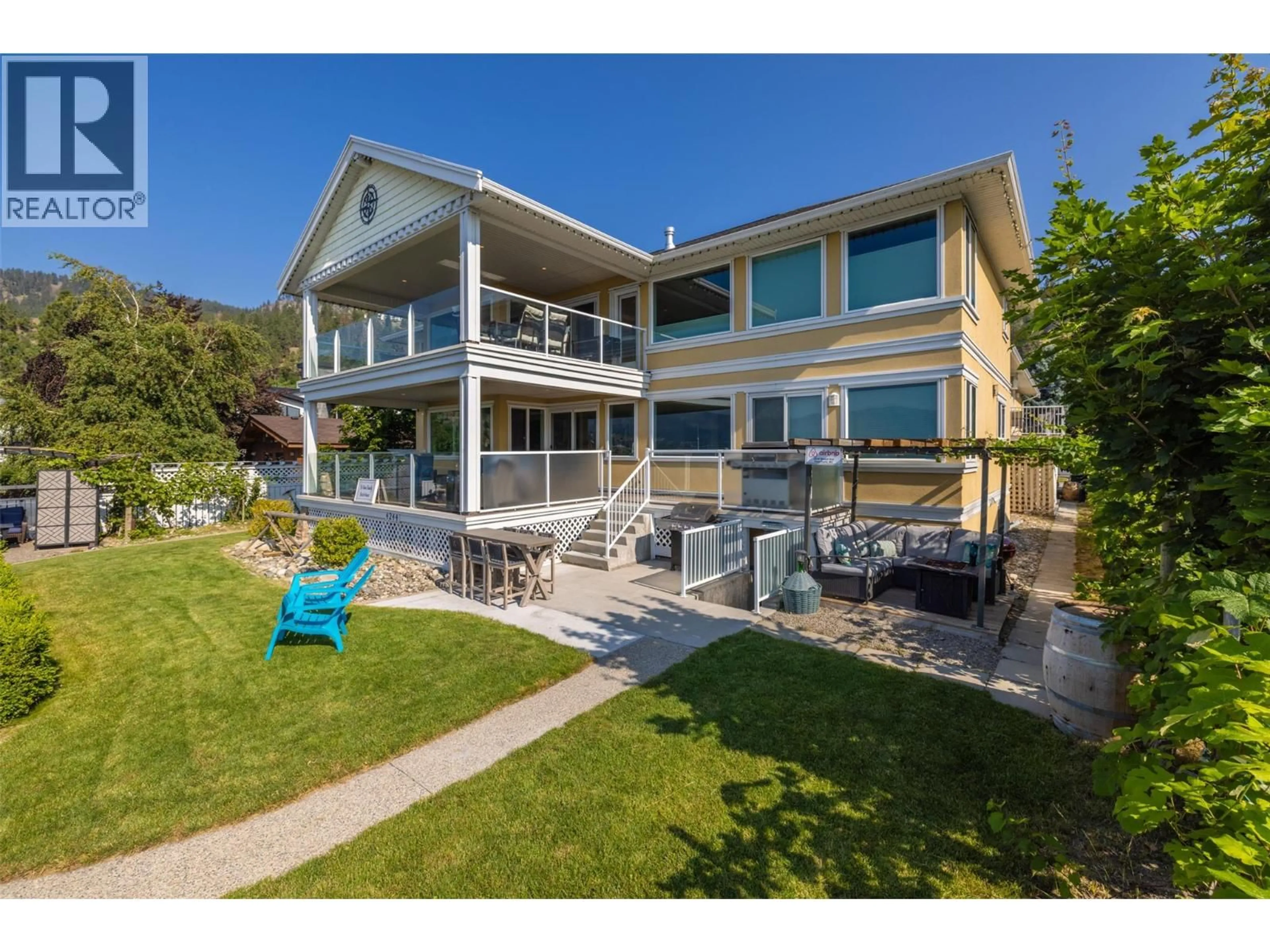 A pic from outside/outdoor area/front of a property/back of a property/a pic from drone, water/lake/river/ocean view for 4244 BEACH AVENUE, Peachland British Columbia V0H1X6