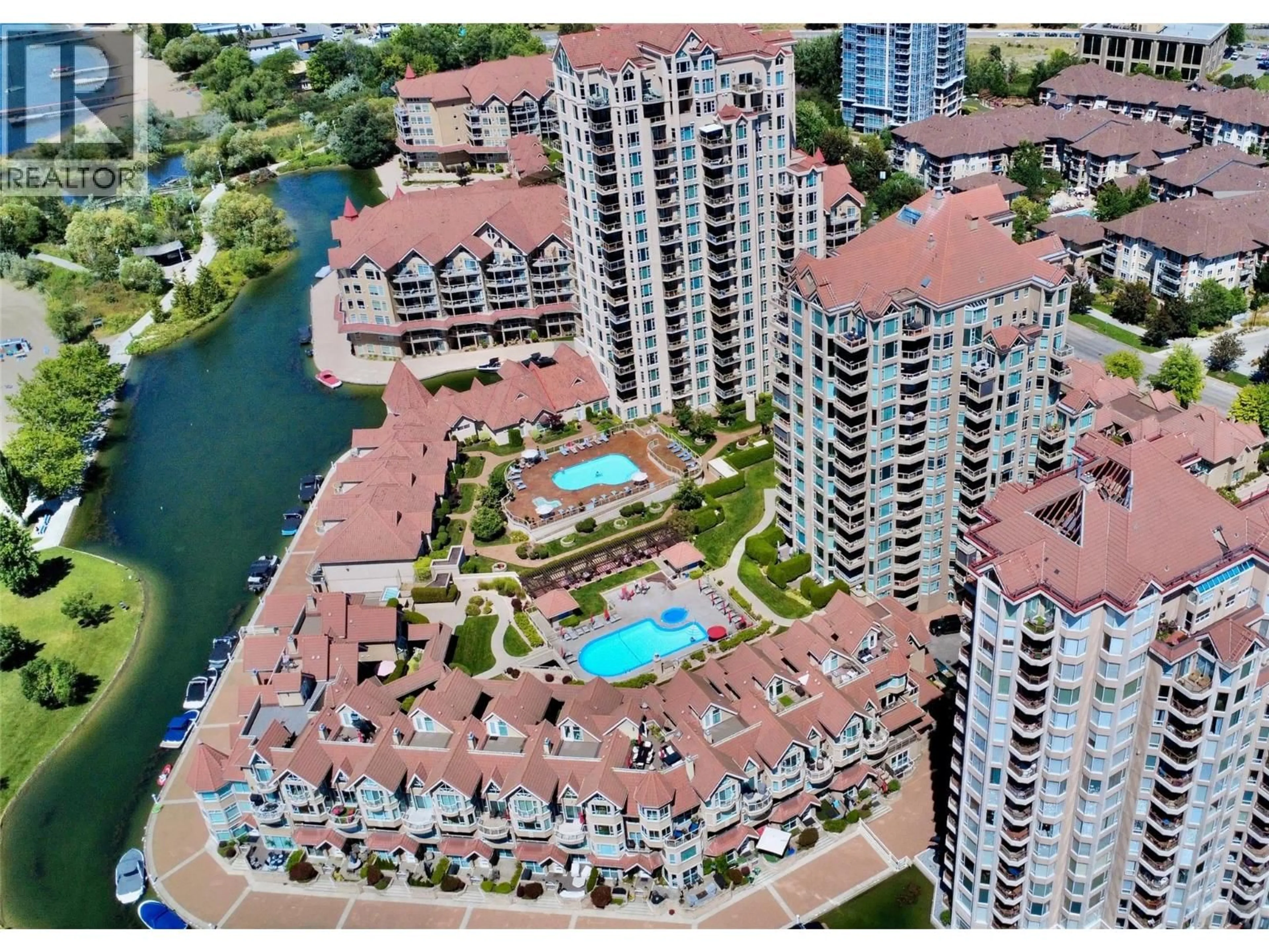A pic from outside/outdoor area/front of a property/back of a property/a pic from drone, water/lake/river/ocean view for 903 - 1152 SUNSET DRIVE, Kelowna British Columbia V1Y9R7
