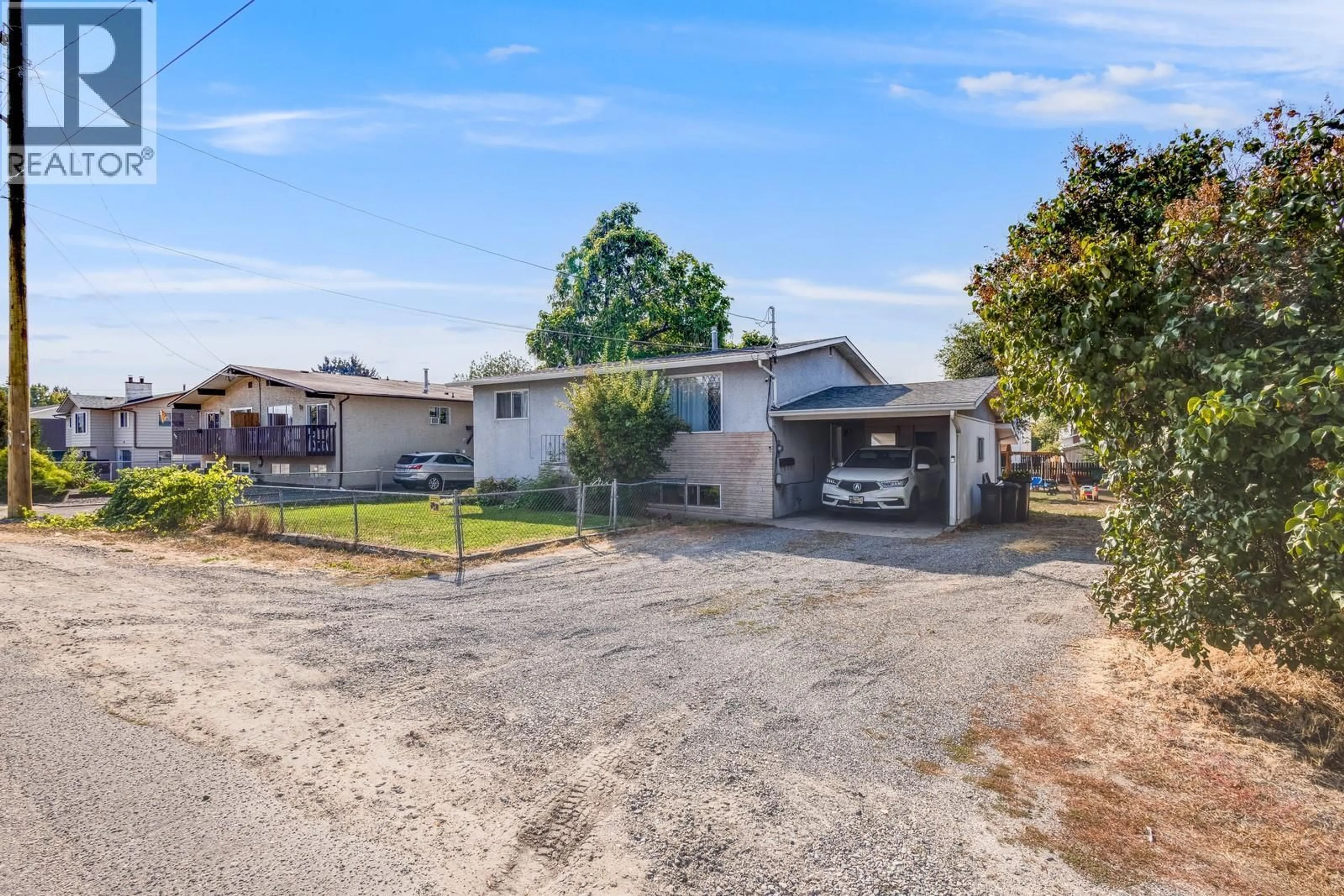 A pic from outside/outdoor area/front of a property/back of a property/a pic from drone, street for 470 GERSTMAR ROAD, Kelowna British Columbia V1X4B1