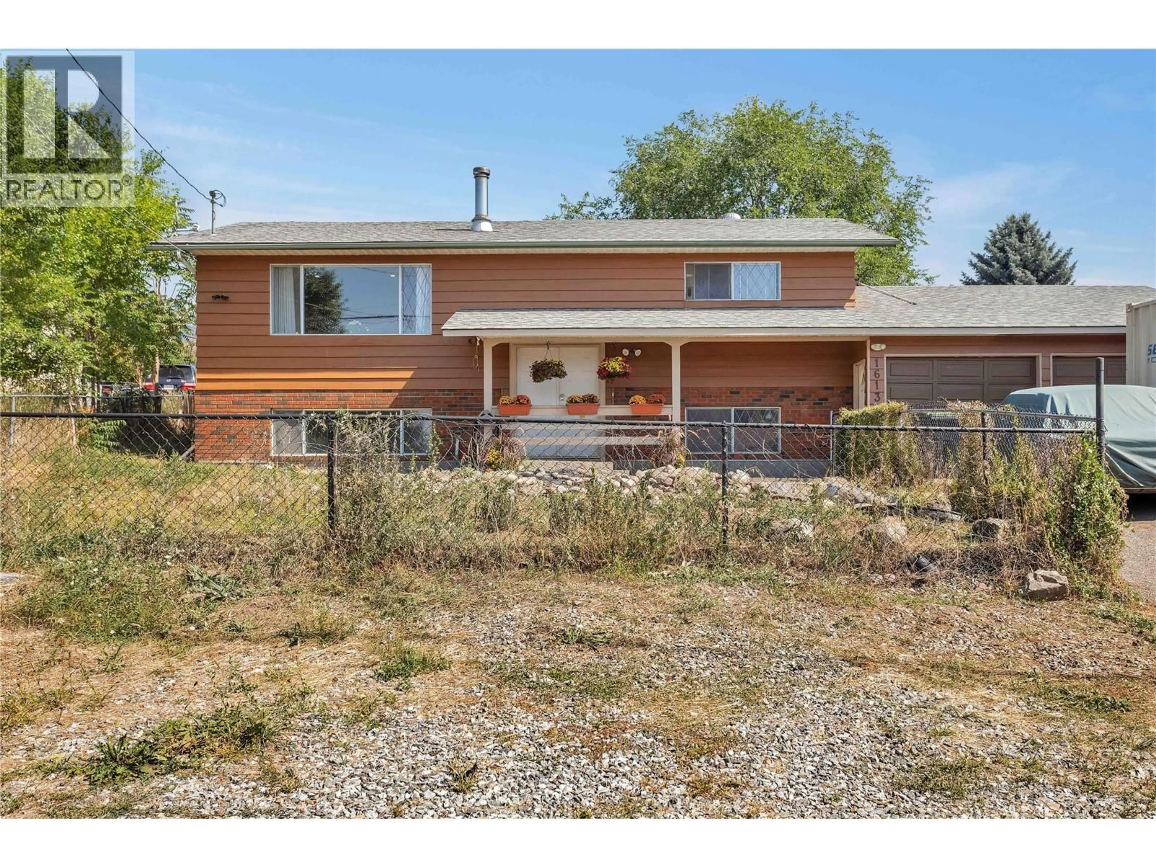Home with brick exterior material, street for 1613 TRAUT ROAD, Kelowna British Columbia V1P1E6
