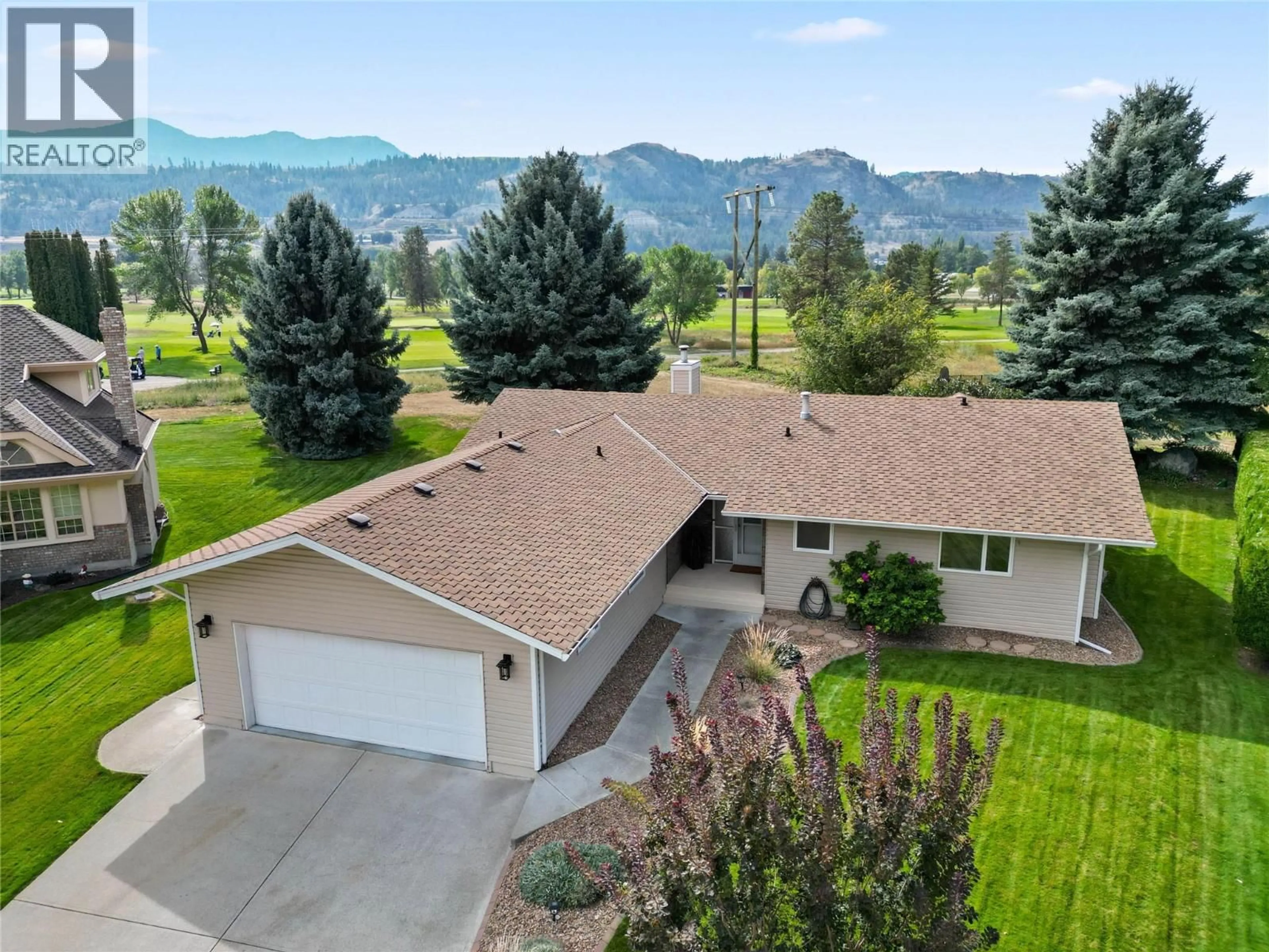 A pic from outside/outdoor area/front of a property/back of a property/a pic from drone, mountain view for 449 NUEVA WYND, Kamloops British Columbia V2H1S1