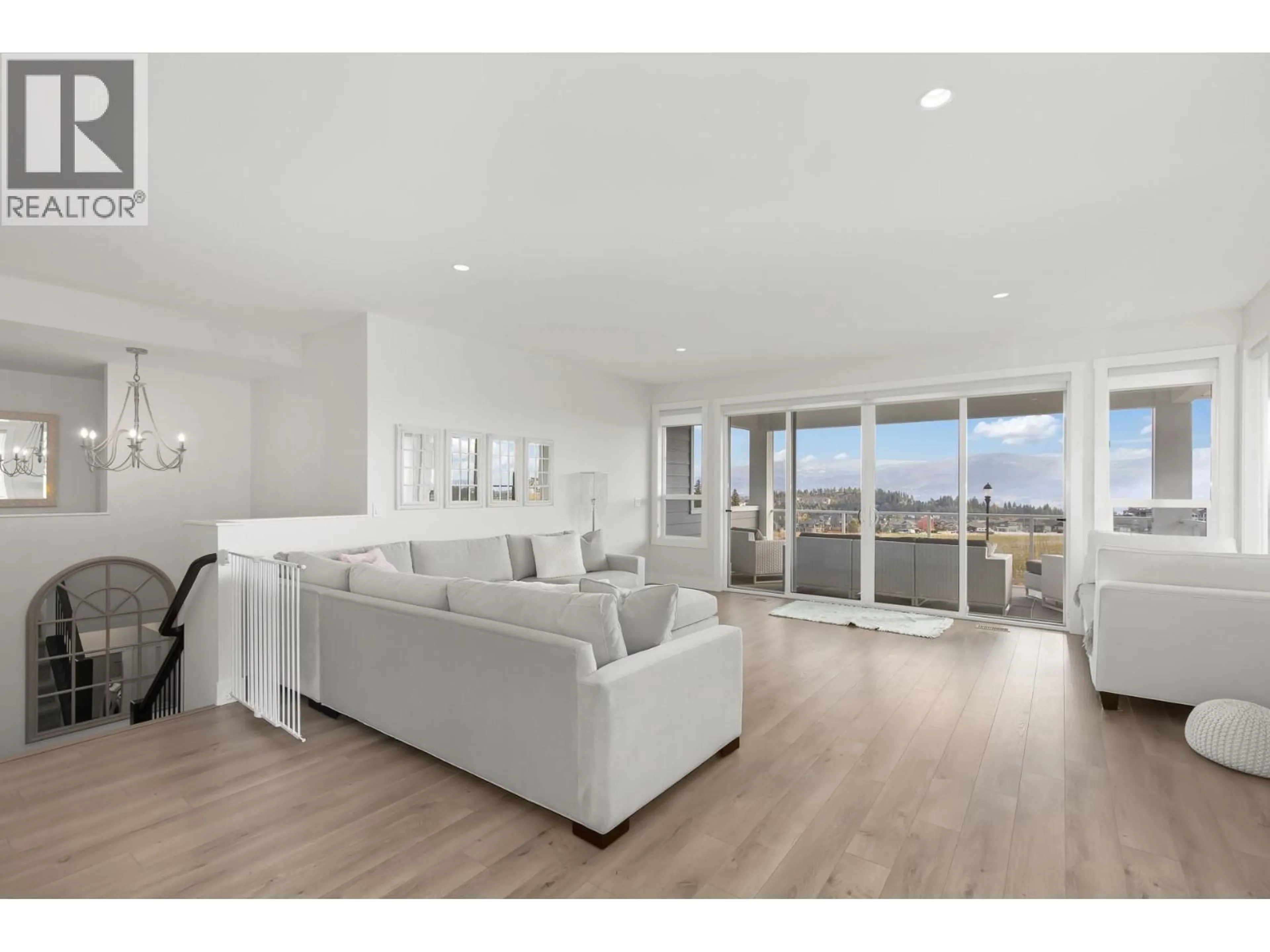 Living room with furniture, wood/laminate floor for 2612 PARAMOUNT DRIVE, West Kelowna British Columbia V4T3N3