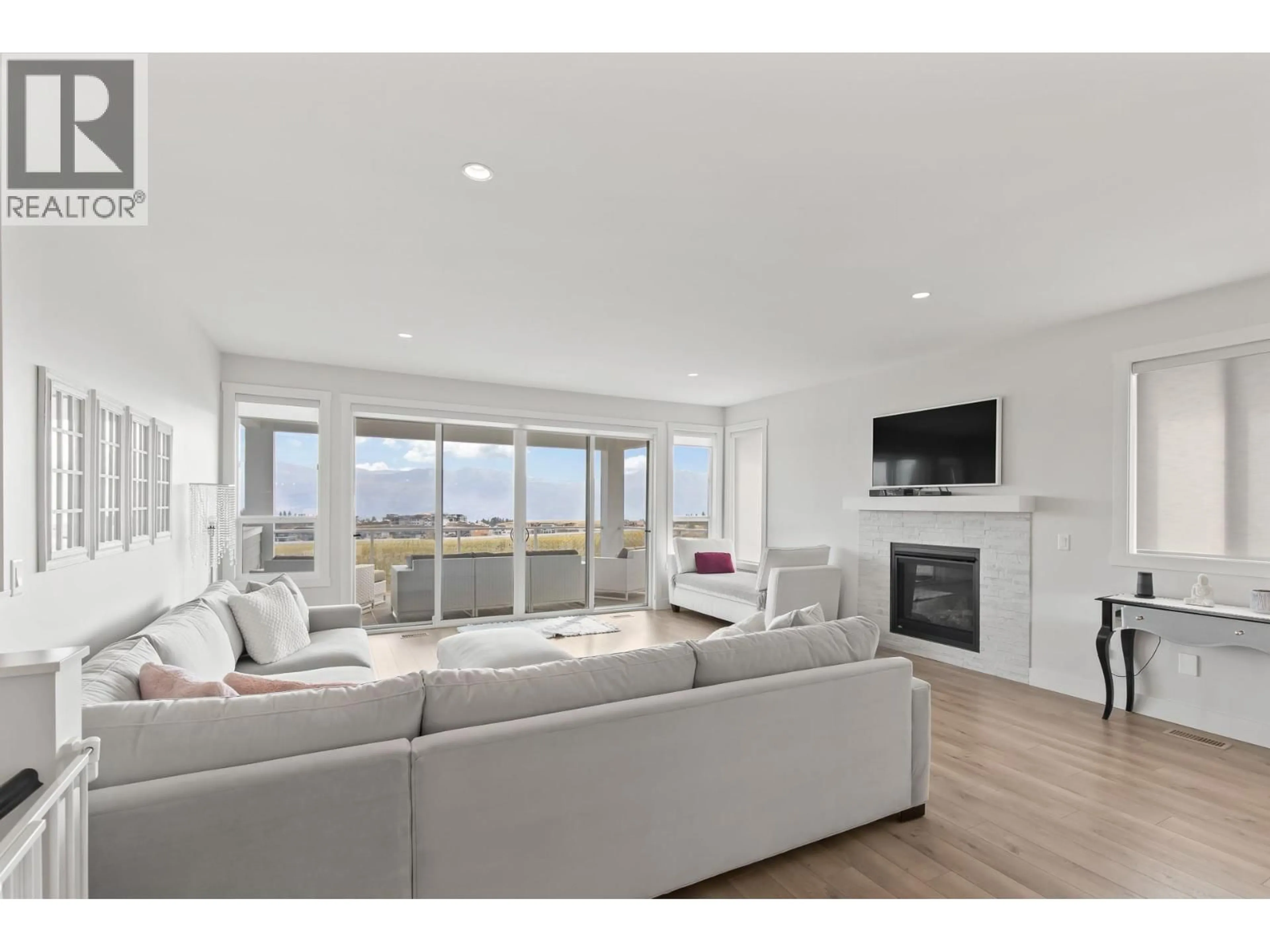 Living room with furniture, wood/laminate floor for 2612 PARAMOUNT DRIVE, West Kelowna British Columbia V4T3N3
