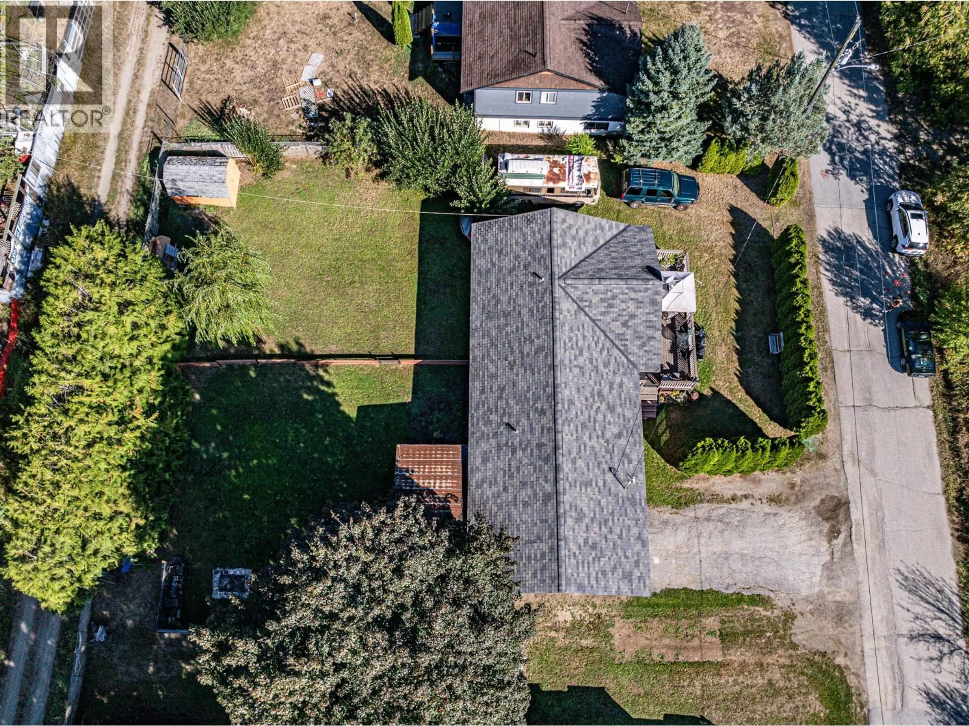 A pic from outside/outdoor area/front of a property/back of a property/a pic from drone, street for 804 CEDAR AVENUE, Salmo British Columbia V0G1Z0