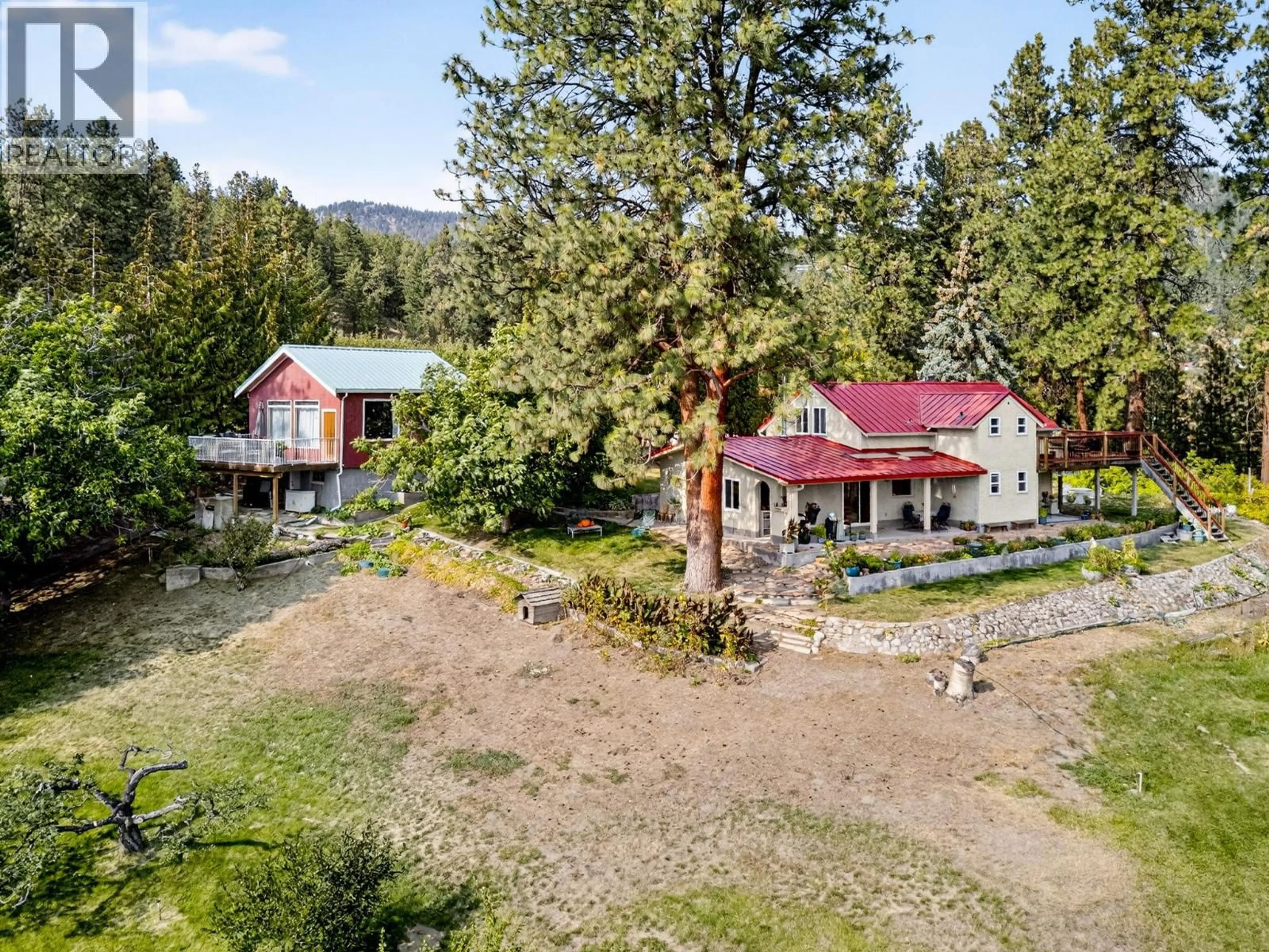 A pic from outside/outdoor area/front of a property/back of a property/a pic from drone, mountain view for 5010 ELLIOTT AVENUE, Peachland British Columbia V0H1X8