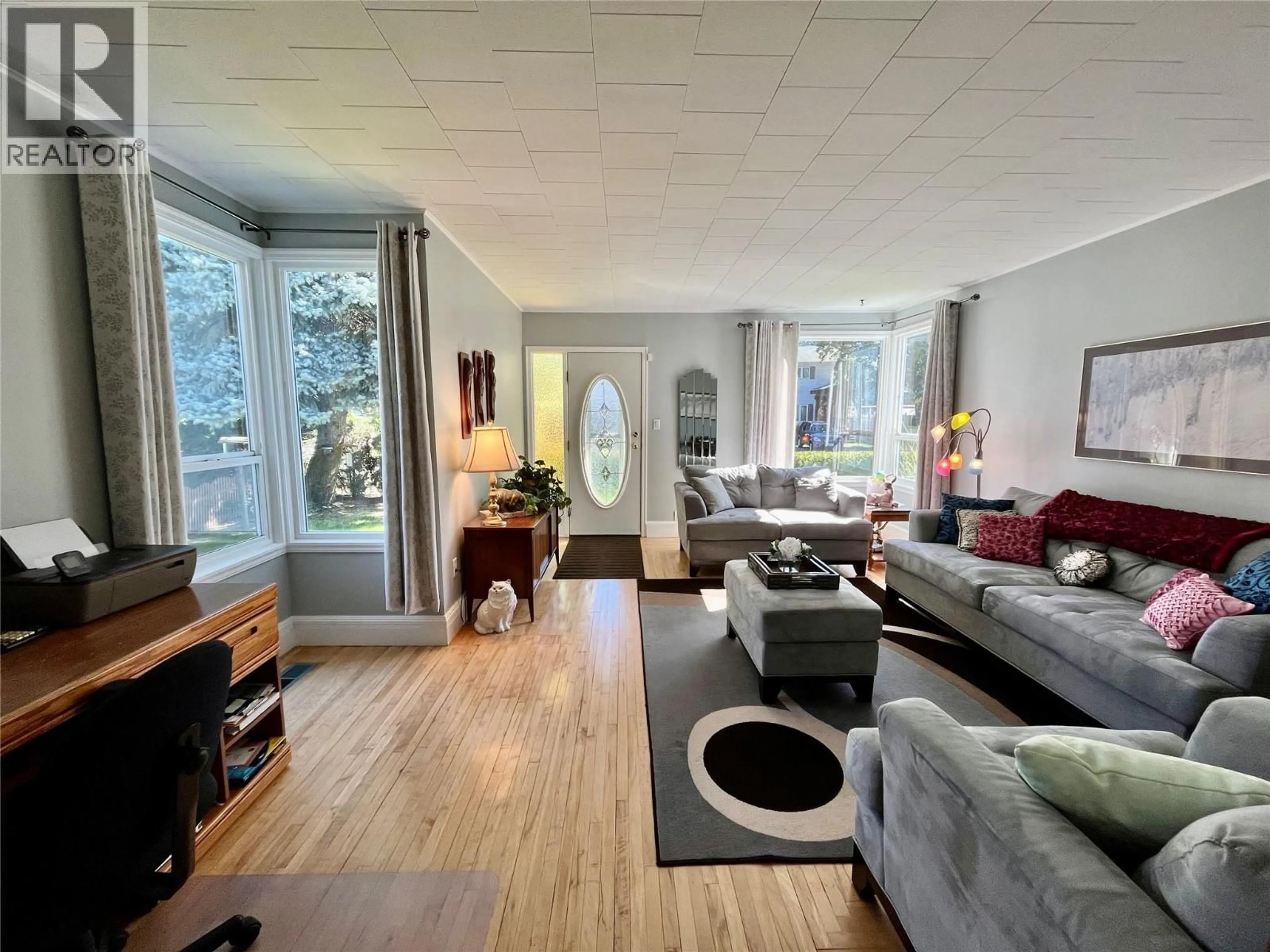 Living room with furniture, wood/laminate floor for 120 4TH AVENUE NORTHWEST, Nakusp British Columbia V0G1R0